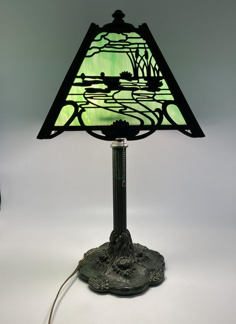 Art Nouveau Slag Glass 'Lily Pond' Lamp: Art Nouveau Slag Glass 'Lily Pond' Lamp. Both the shade and base with busy 'Lily Pond" design. Unmarked. Good condition. Measures 23-1/2" H overall. The shade measures 10" H x 16" W. The base has a 9"