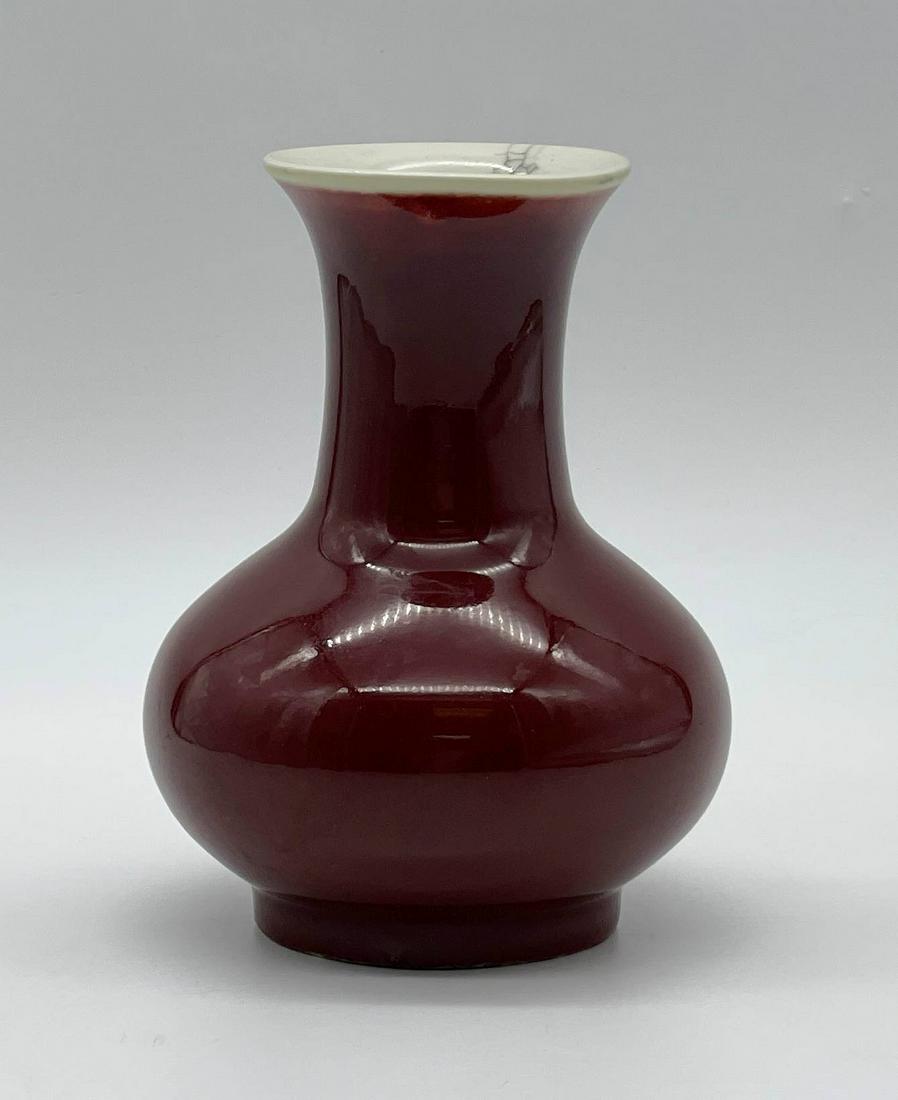 19C Chinese Sang De Bouef Flambe Porcelain Vase: 19C Chinese Sang De Bouef Flambe Porcelain Vase. Unsigned. Lightly crazed on bottom and interior. Good condition. Measures 5-3/4" H x 4-1/2" W. All Items Are Third party shipping or free local pick-up