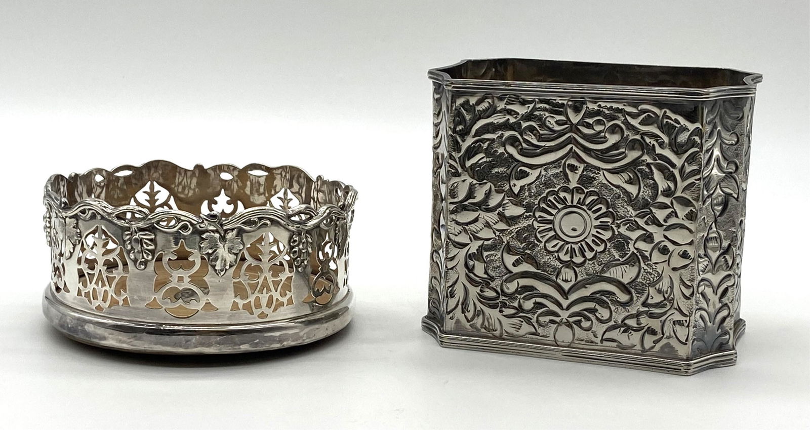 Antique English Wine and Liquor Coaster and Holder: Antique English Wine and Liquor Coaster and Holder. Silver Plated liquor holder and wine coaster. Coaster measures 2.5" H x 5.5" D, Liquor holder 4 7/8" H x 5.5" D. In good condition. All Items Are Th