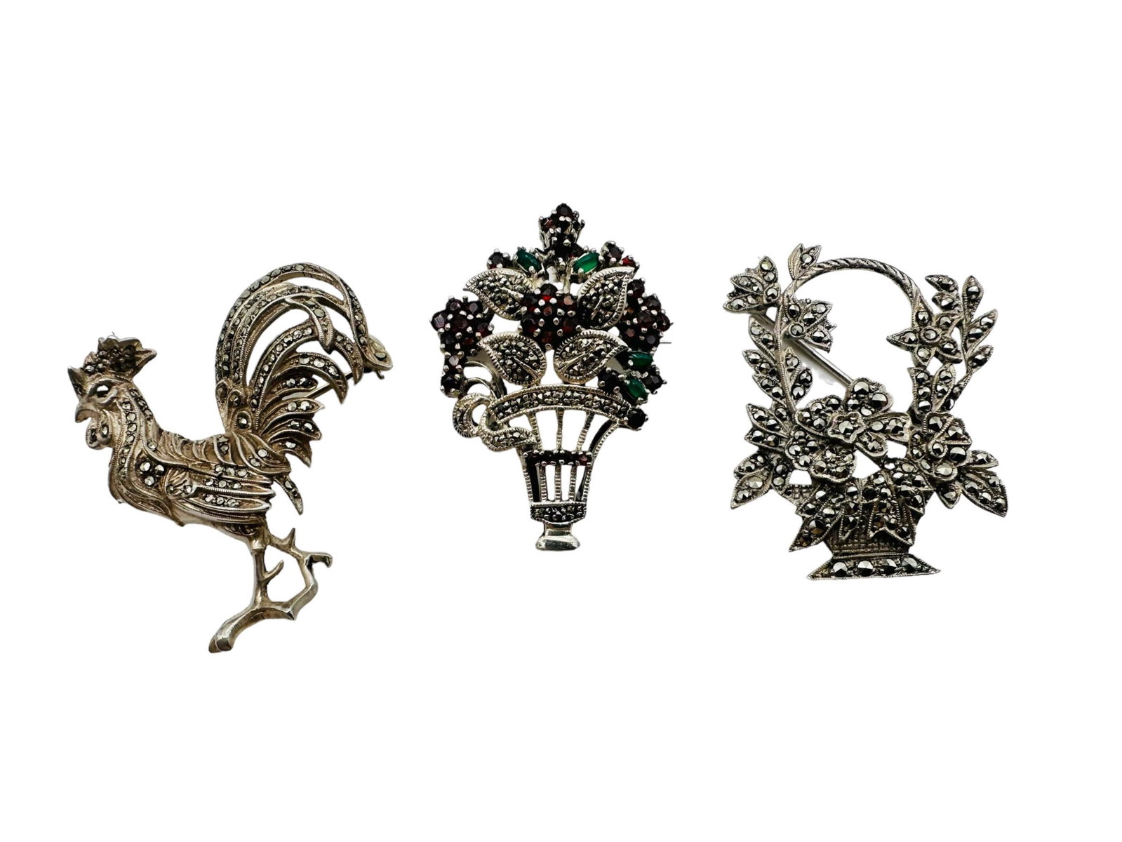 Three Marcasite 925 Silver Brooches: Three Marcasite 925 Silver Brooches. Two marked, all tested. Approximately measures and weighs 1.5", 27 grams. In good condition. All Items Are Third party shipping or free local pick-up within 60 day