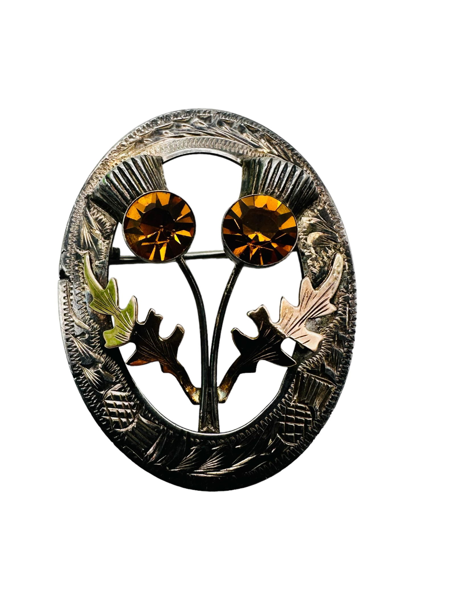 English Sterling Silver Citrine Thislte Kilt Brooch: Antique English Sterling Silver Citrine Thistle Kilt Brooch. Marked. Approximately measures and weighs 1.5", 8 grams. In good condition. All Items Are Third party shipping or free local pick-up within