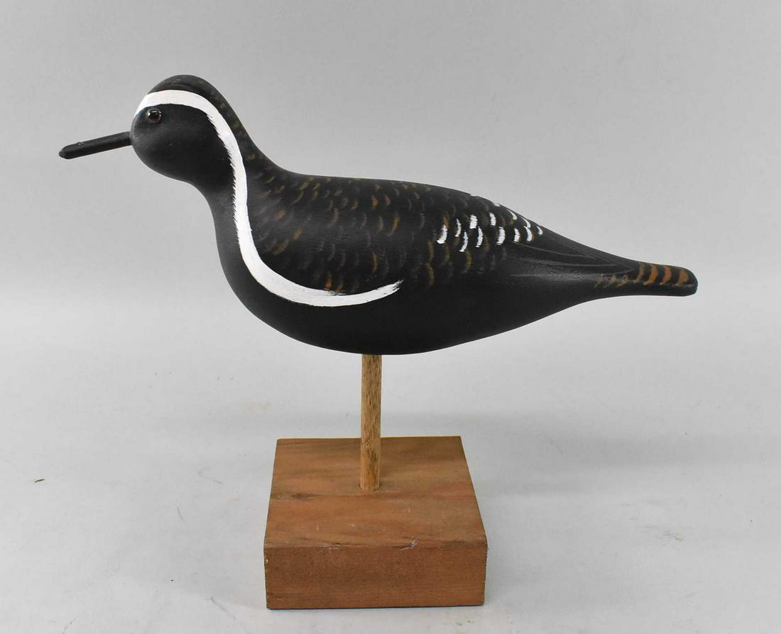 Black Bellied Plover Decoy by JB Cerreta: Black Bellied Plover by JB Cerreta. There is slight paint loss on the beak, the base and bottom of bird are both signed. Dimensions 11 1/2" long x 5" tall x 3" wide, total dimensions with base 11 1/2"