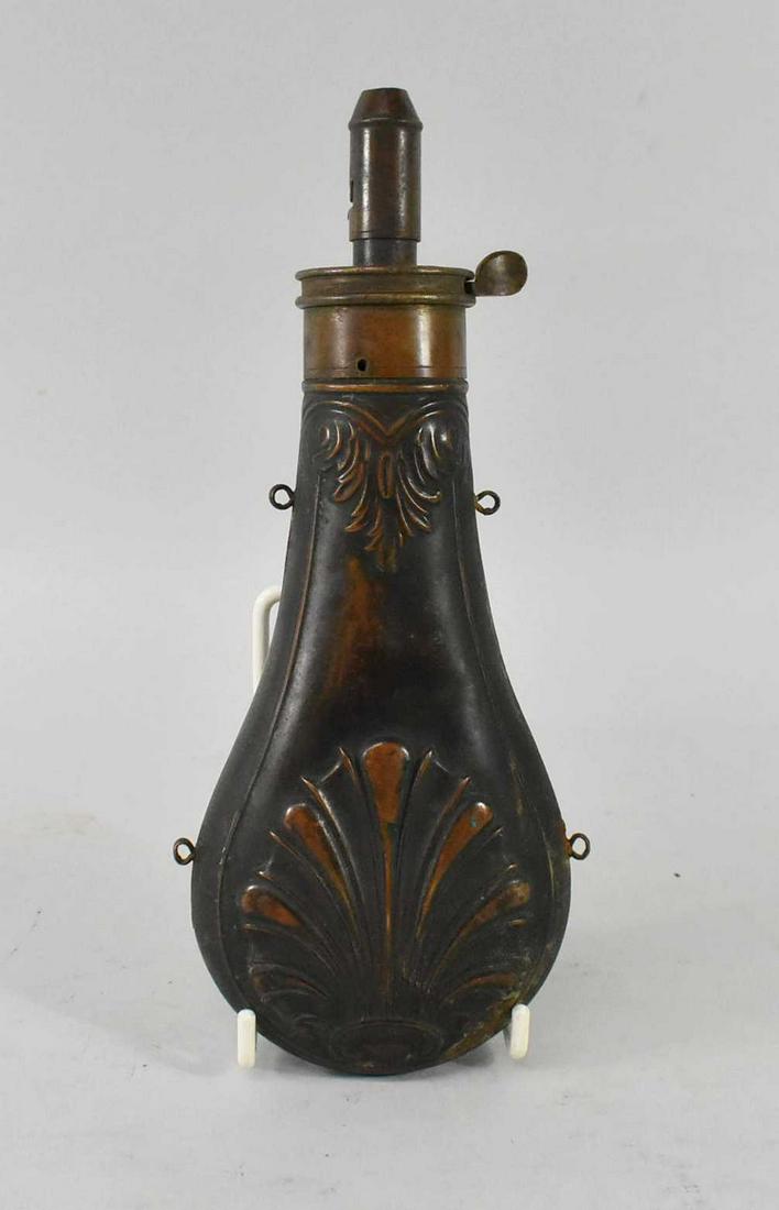 Orig Civil War Era Am Flask Cap Co Powder Flask: Original Civil War Era Powder flask with shell pattern on bottom, minor dents from use. Thumb lever and top move easily. Marked on the top Am. Flask and Cap Co. Dimensions 8 1/2" tall x 3 3/4" wide x 