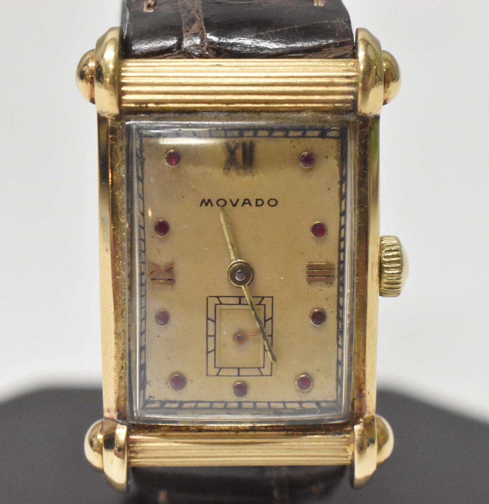 14K Movado 1940's Wristwatch: 14K Movado 1940's wristwatch. Unusual Art Deco style case, marked Movado 14K, 17J movement, some general wear, running condition when catalogued. Est 24 grams