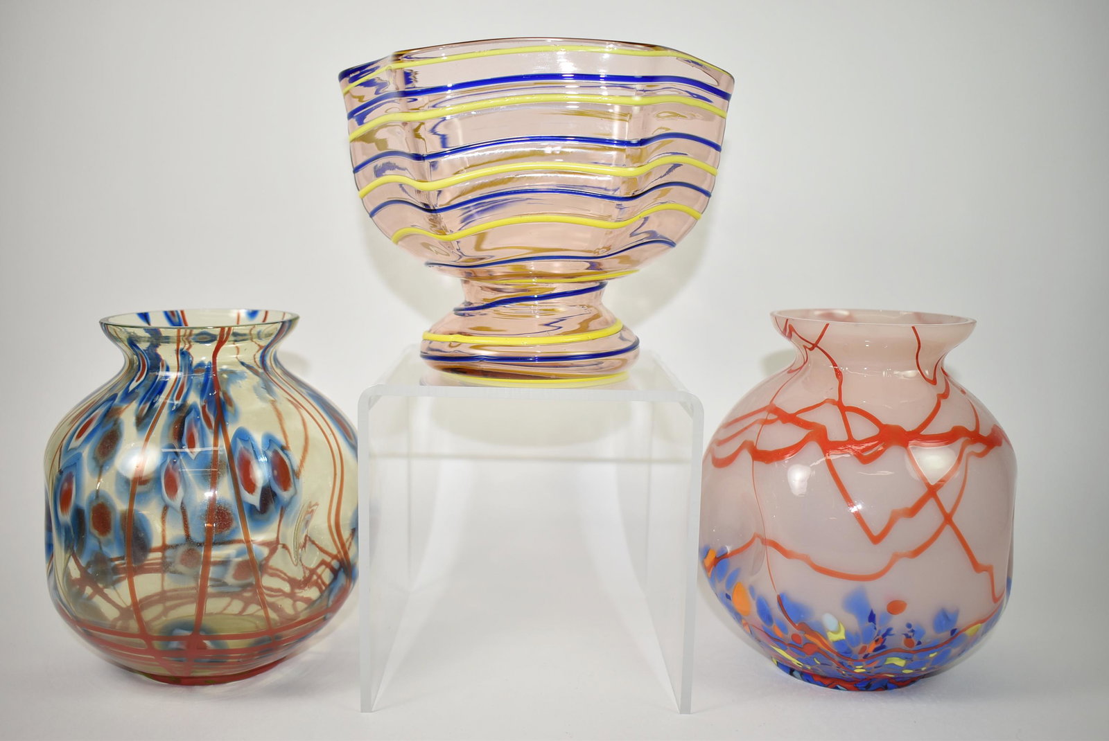 3 Pieces Kralik Czech Art Glass: 3 pieces Kralik Czech art glass. Kralik glass footed bowl. Rose tone with blue and yellow threading, ground pontil. 6" x 5 1/2" tall. Uranium glass with blue and red designs, pinched sides, ground and