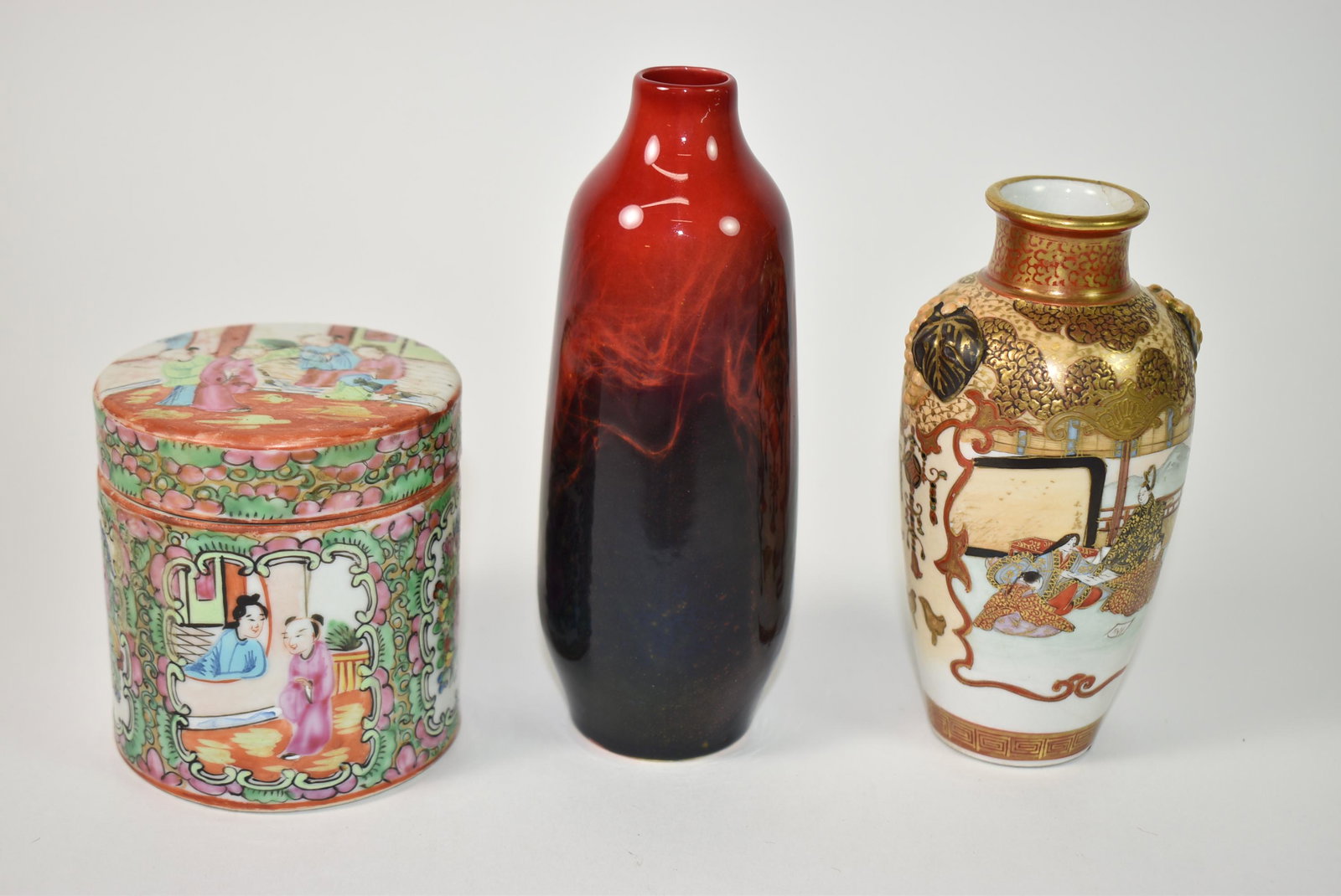 2 Vases and Tea Caddy, Royal Doulton Flambe: 2 vases and tea caddy. Royal Doulton Flambe Veines, glaze flaw in the manufacturing, 6" tall x 2". Chinese vase, hallmarked, 5" x 2 1/2". Famille Rose tea caddy box, 3" x 3".