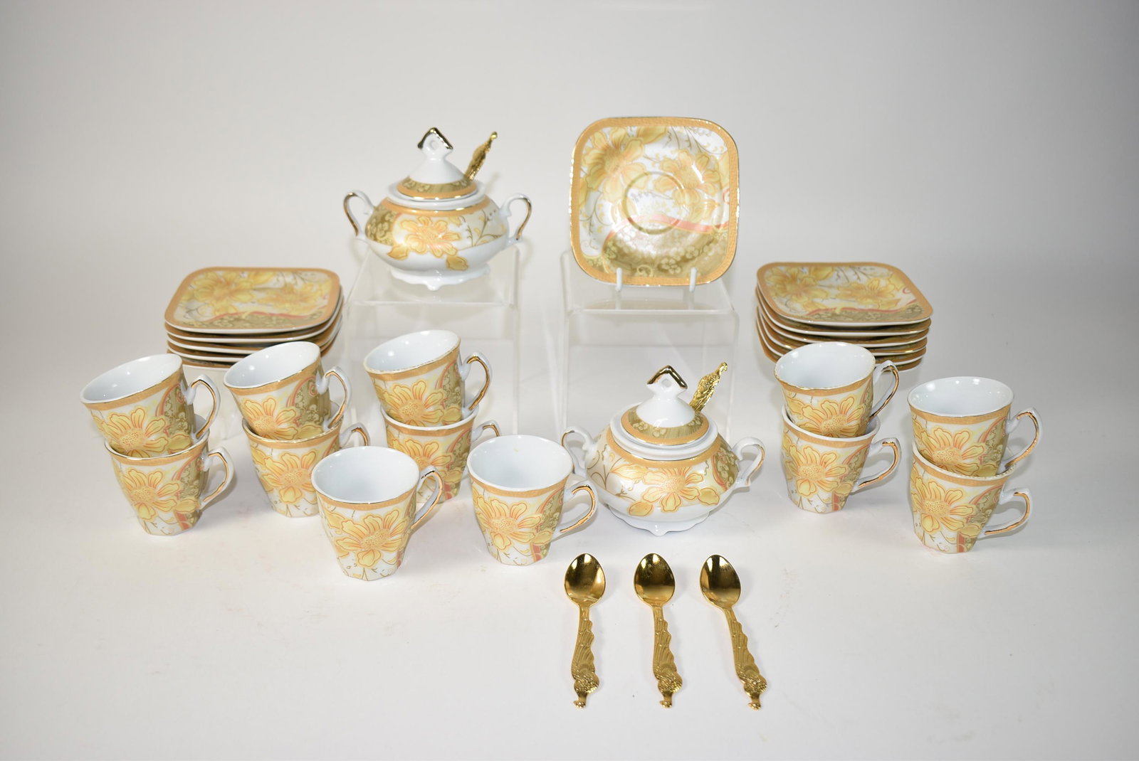 H.D. China Demitasse Set: H.D. China Demitasse Set, 2 sugar bowls, 12 cups 2 1/4" tall, 12 saucers 3 3/4" diameter, 5 gold colored peacock spoons.