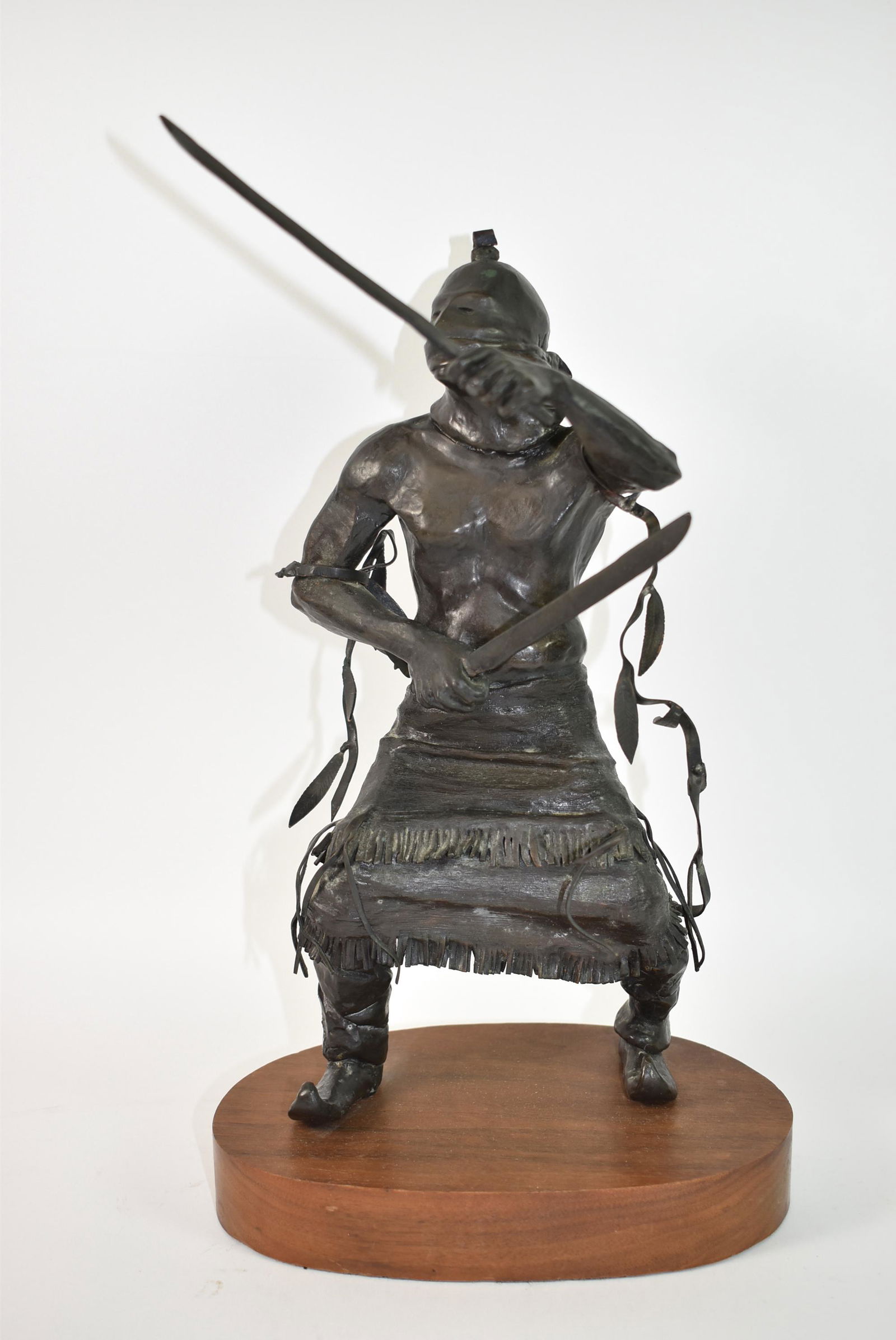 Native American Warrior Bronze, Herbert: Western Native American warrior bronze with 2 swords or long knives, signed Gary R Herbert 1975, 3/30. 13 3/4" x 7 1/2" x 5".