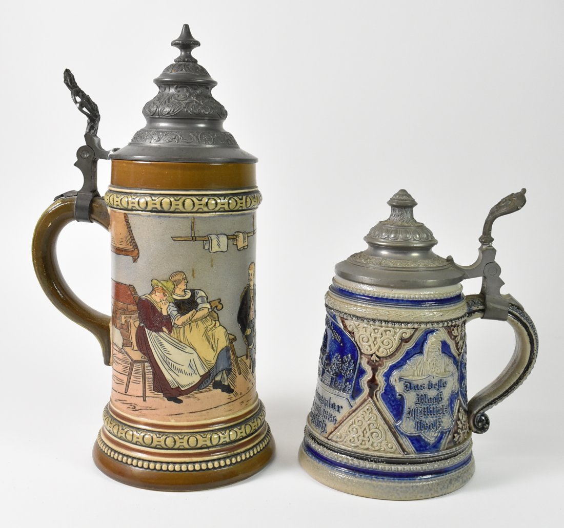 Hauber & Reuther HR #411German Stein & U Of M Crest Stein: German stein with University Of Michigan Crest. 7.25" tall x 5.5" wide to finger lever. Very nice condition. Hauber & Reuther HR German. Soldered lid repair. Lounging scene. 10.75" tall x 5.5" wide.