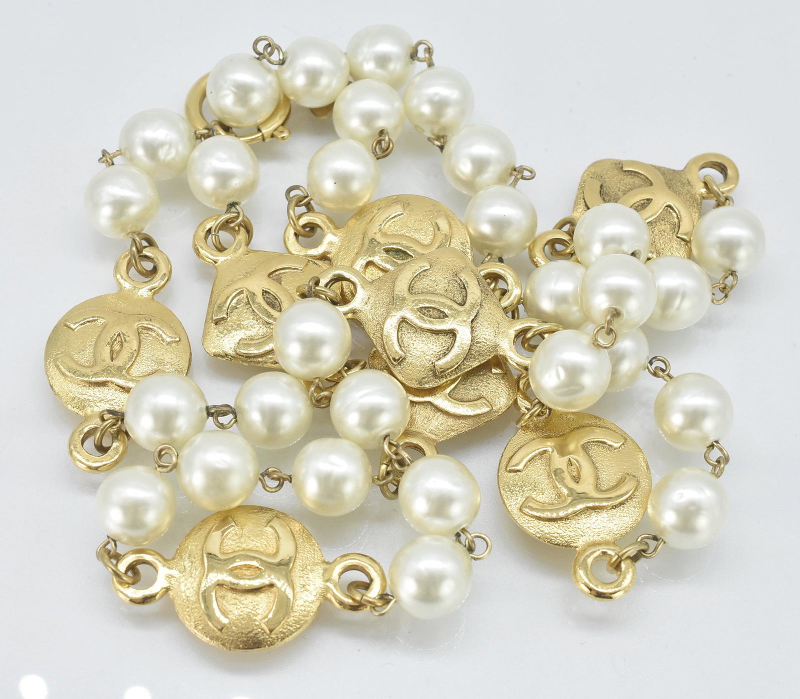 Chanel '80 Faux Pearl and 10 Gold Tone Medallions: Chanel 1980s Faux Pearl and 10 Gold Tone Chanel Emblem Medallions Necklace, Stamped 29, Made in France, 35 1/2" long, 167.3 grams