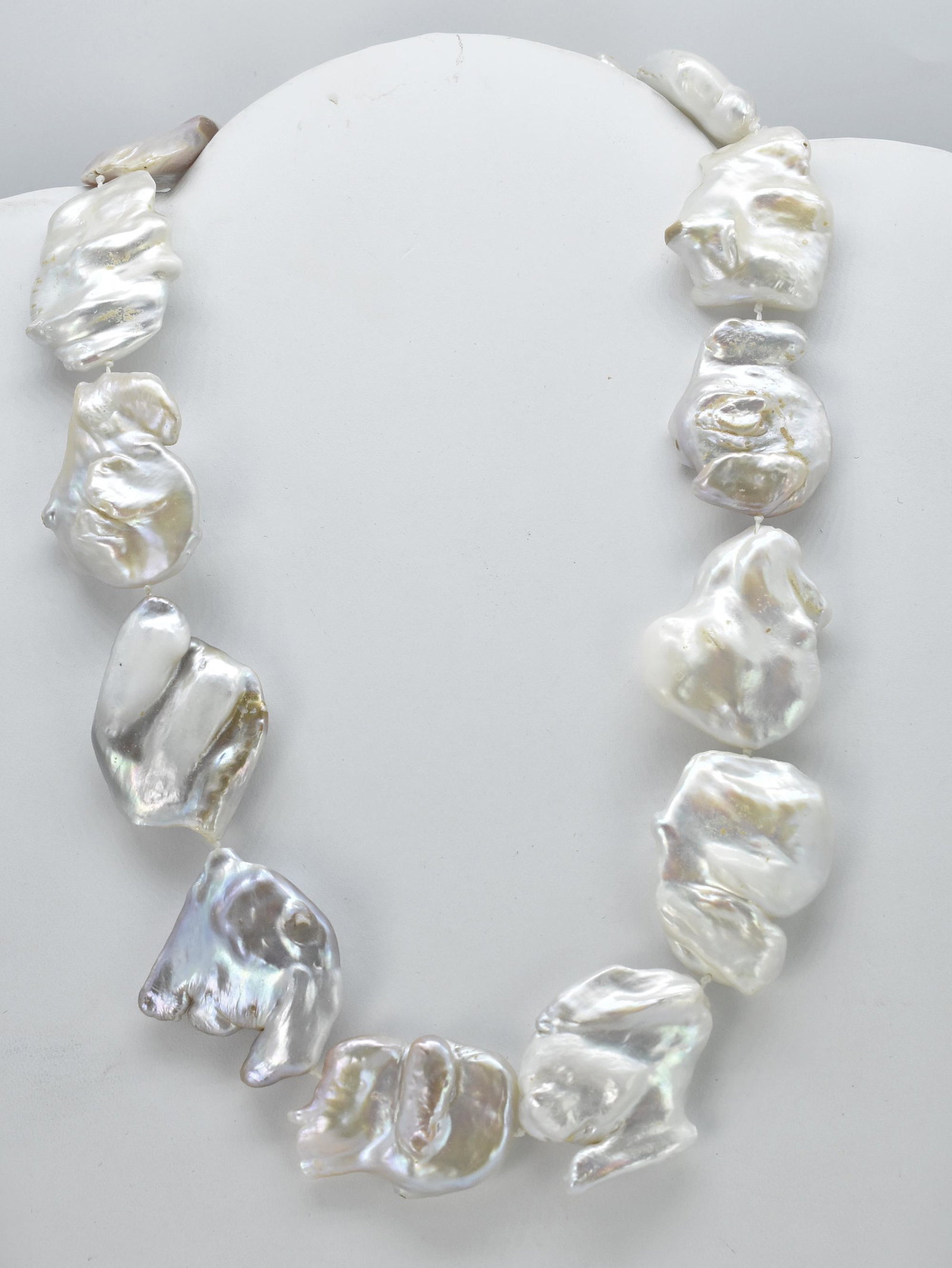 Fresh Water Pearl Necklace, 19" long: Fresh Water Pearl Necklace, 13 Very large fresh water pearls, irregular shapes of 1" x 1 1/4" to 1 1/2", 14K Yellow Gold clasp, Beautiful varied iridescent colors of white, pink, green and lavender, M