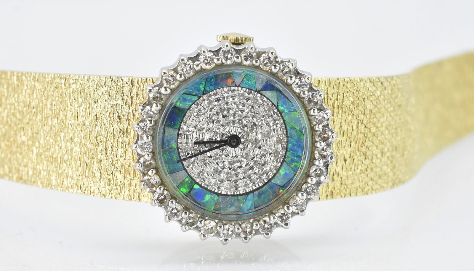 Ladies Croton 14K Watch With 1 ct Diamond and Opal Dial: Ladies Croton 14k yellow gold watch. Watch band and case are marked 14K. Watch face has a diamond surround, diamond encrusted dial, and opal band surrounding the dial.1.0 cttw diamonds. 36.5 grams w/o