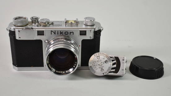 Vintage Nikon 35 mm Camera: Nearly Nikon 35 mm camera, 1:14 FS lens, very clean, not tested with light meter