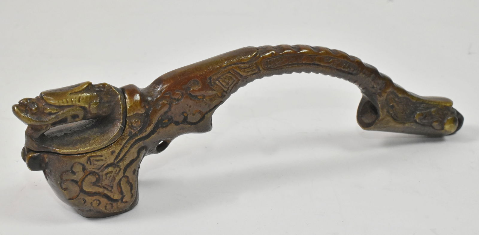 Antique Japanese Bronze Yatate Dragon Calligraphy Ink Well, mid 1800s: Antique Japanese Bronze Yatate Dragon Calligraphy Ink Well, mid 1800s, 6 1/2" long, 1 1/4" tall x 3/4" wide, This ornate Yatate is in the form of a mythical dragon with the dragon's head forming the h