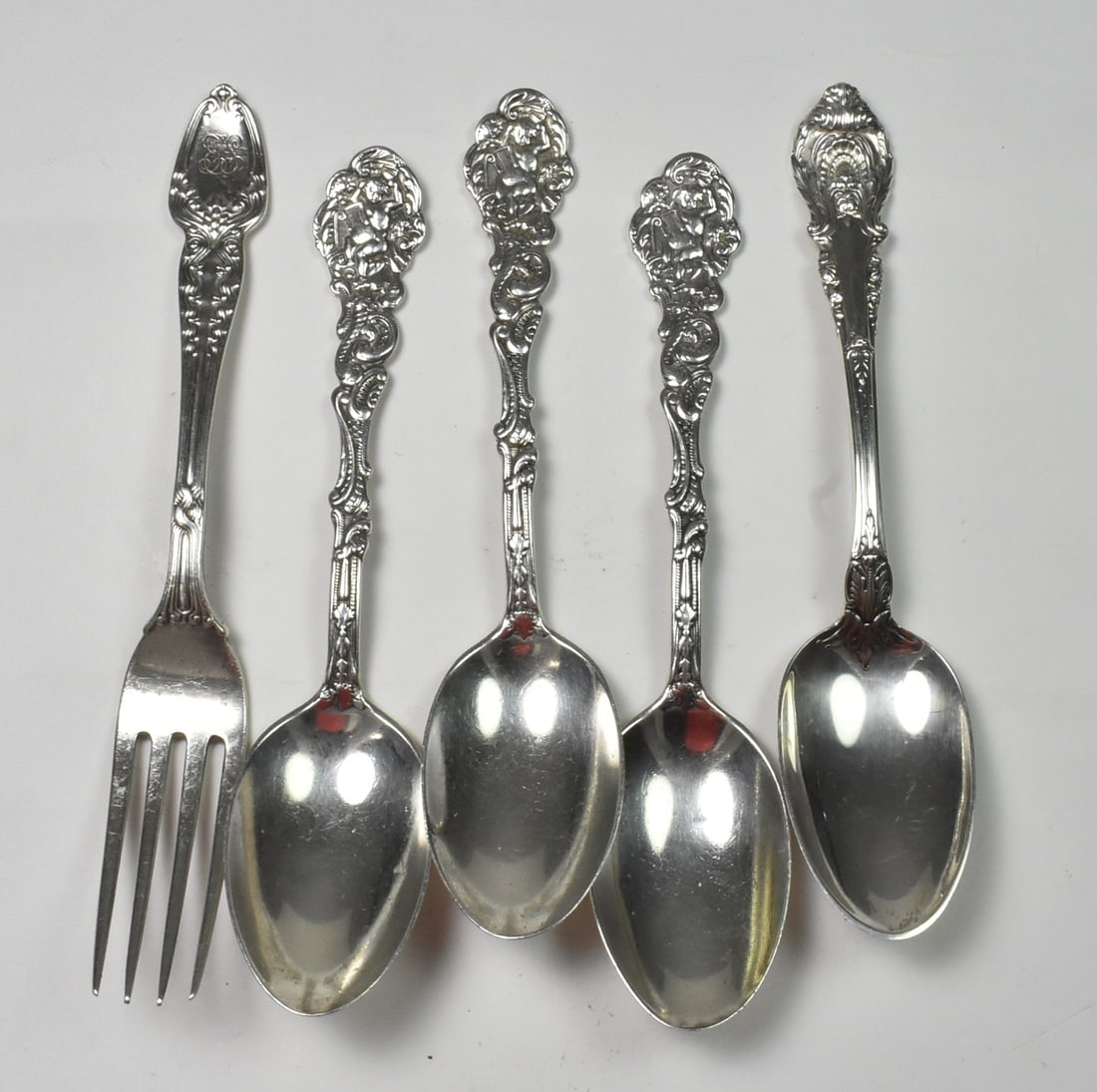 5 piece Sterling Lot, Tiffany, Gorham, Wallace: This lot of sterling includes Tiffany & Co, Wallace Silver and Gorham. The Tiffany & Co fork is in the pattern broom corn. The fork is 6 3/8" and monogrammed "EJS". The Wallace Silver teaspoon is in t