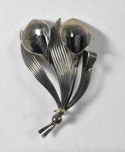 Niels Erik From, Denmark Sterling Brooch: This Niels Erik From brooch has a double calla lily design. This piece of Denmark sterling is hallmarked N.E. From, Denmark, Sterling on the backside. The brooch is 2 3/4" tall x 1 3/4" wide, 12.3