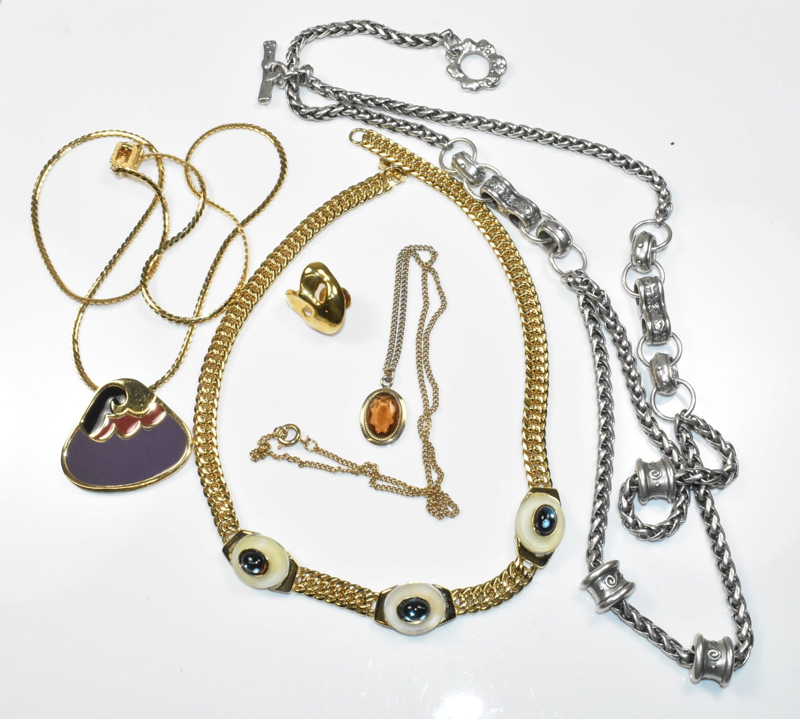 Fashion Jewelry Group with Pierre Cardin, Givenchy, Danon, Sarah Coventry: Fashion jewelry group includes Pierre Cardin 16" x 1/4" necklace with 3 blue fish eye accents, Givenchy 24" necklace with wave design enamel pendant 1 1/2" wide, Sarah Coventry 18" necklace with oval