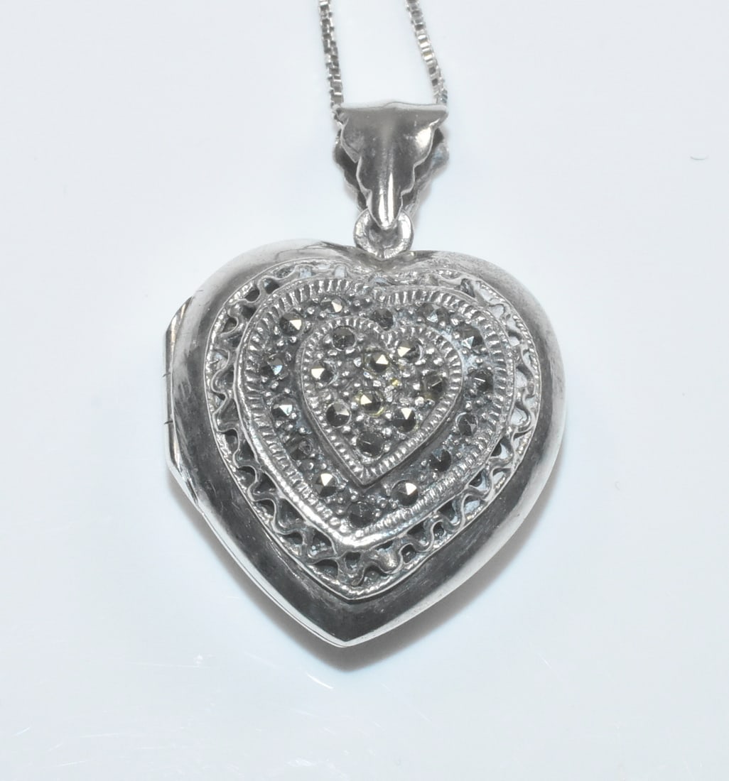 Sterling and Marcasite Heart Locket: Sterling puffy heart locket with marcasites. 1" x 1", 24" chain. 12g.