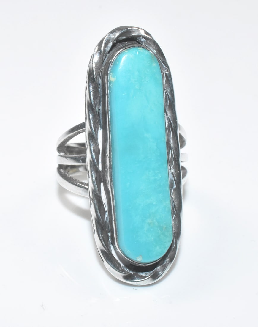 Sterling and Turquoise Oblong Ring: Sterling and turquoise oblong ring, 30mm x 7mm stone, size 6, 10.3g.