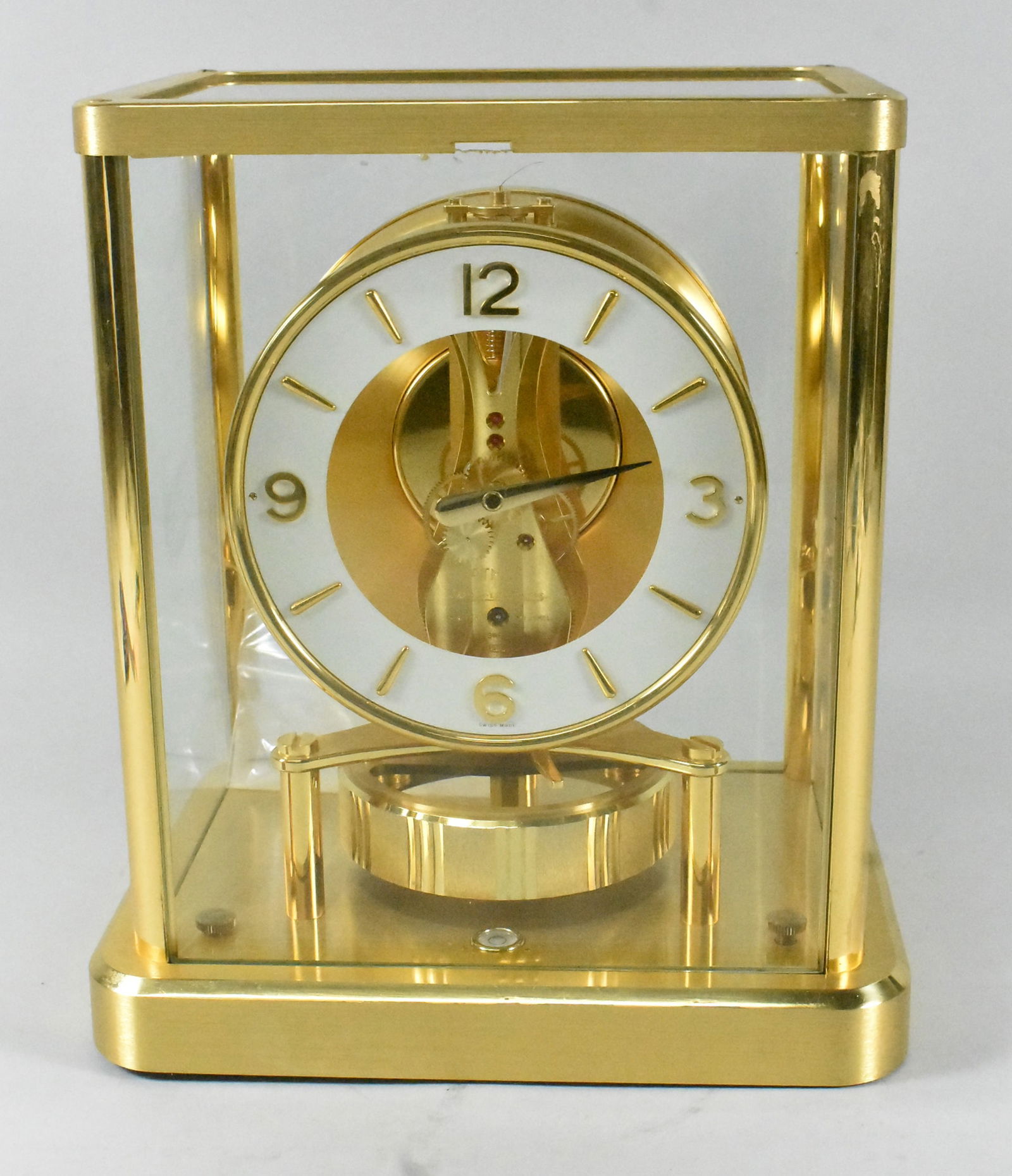 Le Coultre Atmos Clock: Le Coultre Atmos clock with brass frame. 540 caliber, 13 jewel. Running but stops. Minute hand is off and shaft is broken. Very clean.