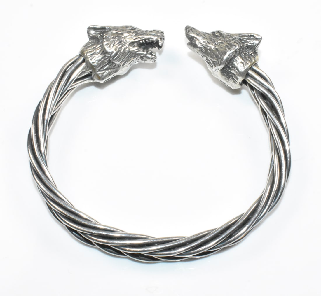 Sterling Braided Wolf Viking Bracelet: Sterling Viking braided bangle bracelet with wolf heads. 6 3/4" with a 1/4" opening. 60g.