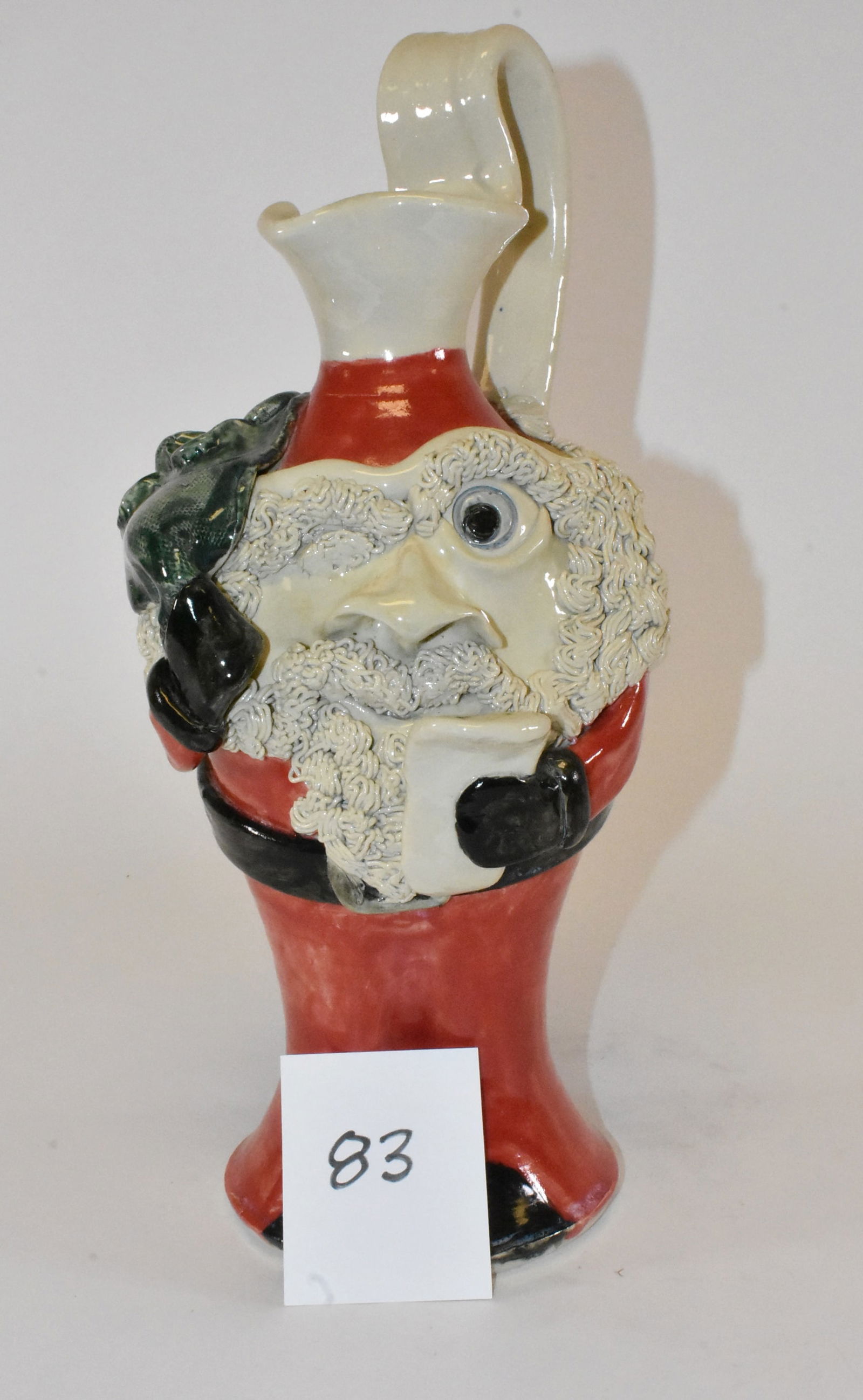 Steve Turpin Ho-Ho #79 Santa Claus Folk Art Jug 2008: Folk art Santa Claus with list by folk pottery artist Steve Turpin. Marked #79 Ho-Ho 2008. 15" tall. No damage.