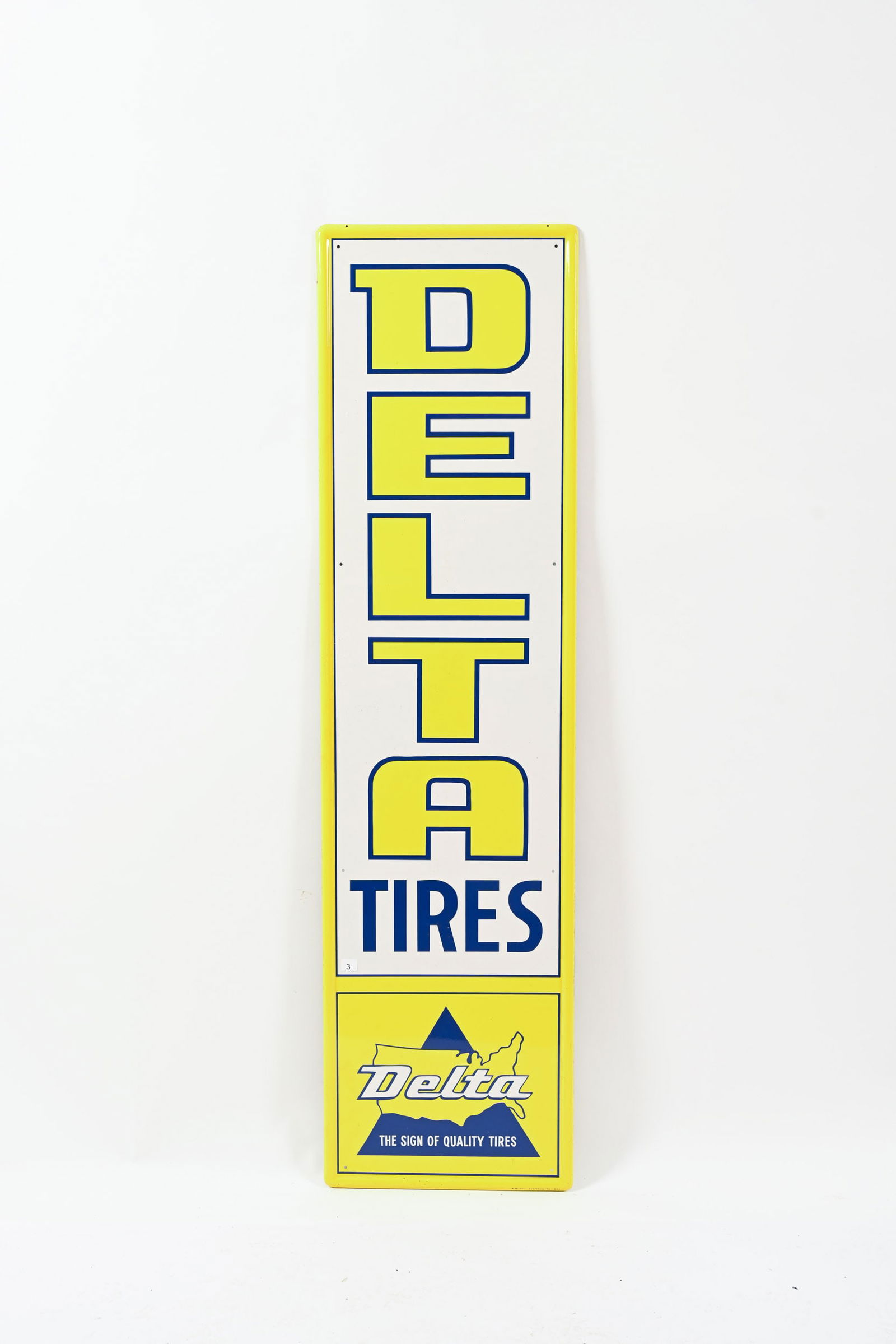 1972 DELTA TIRES TIN VERTICAL SIGN: 1972 DELTA TIRES TIN VERTICAL SIGN MARKED A-M INC. LYNCHBURG 9-72 NEW OLD STOCK CONDITION SELF FRAMED EDGE FIELD IN NEAR MINT CONDITION MILD OXIDATION AT LEFT MIDDLE EDGE EXTENDING INTO FIELD 