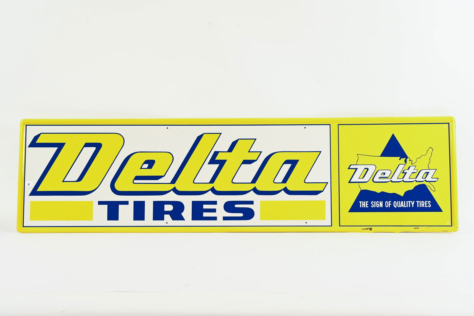 1970 DELTA TRIES TIN HORIZONTAL SIGN: 1970 DELTA TRIES TIN HORIZONTAL SIGN MARKED A-M 12-70 SELF FRAMED EDGE FIELD IN NEAR MINT CONDITION SMALL CREASE WITH PAINT LOSS AT BOTTOM RIGHT SELF FRAMED EDGE SLIGHT BEND TO SIGN 60"X16" *ALL