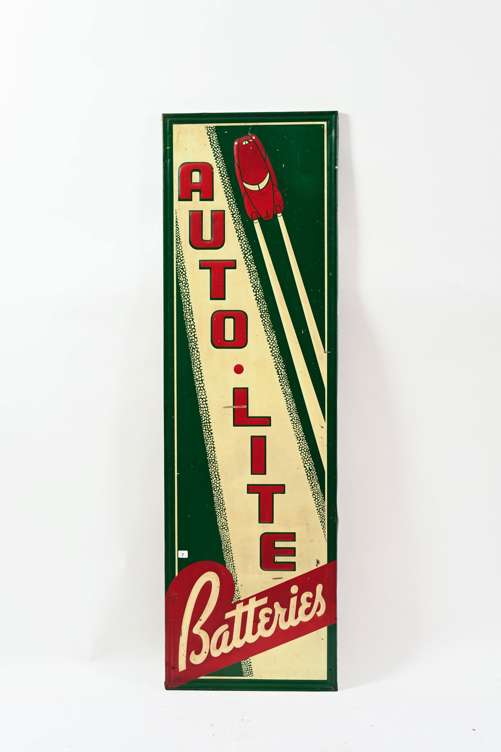 1940'S AUTO-LITE BATTERIES EMBOSSED TIN VERTICAL SIGN: 1940'S AUTO-LITE BATTERIES EMBOSSED TIN VERTICAL SIGN NOT MARKED SELF FRAMED EDGE DISPLAYS WELL WITH GREAT GRAPHICS FIELD SHOWS SOME WEAR AND STAINING MINOR PAINT LOSS IN FIELD PAINT DRIPS ALONG THE R