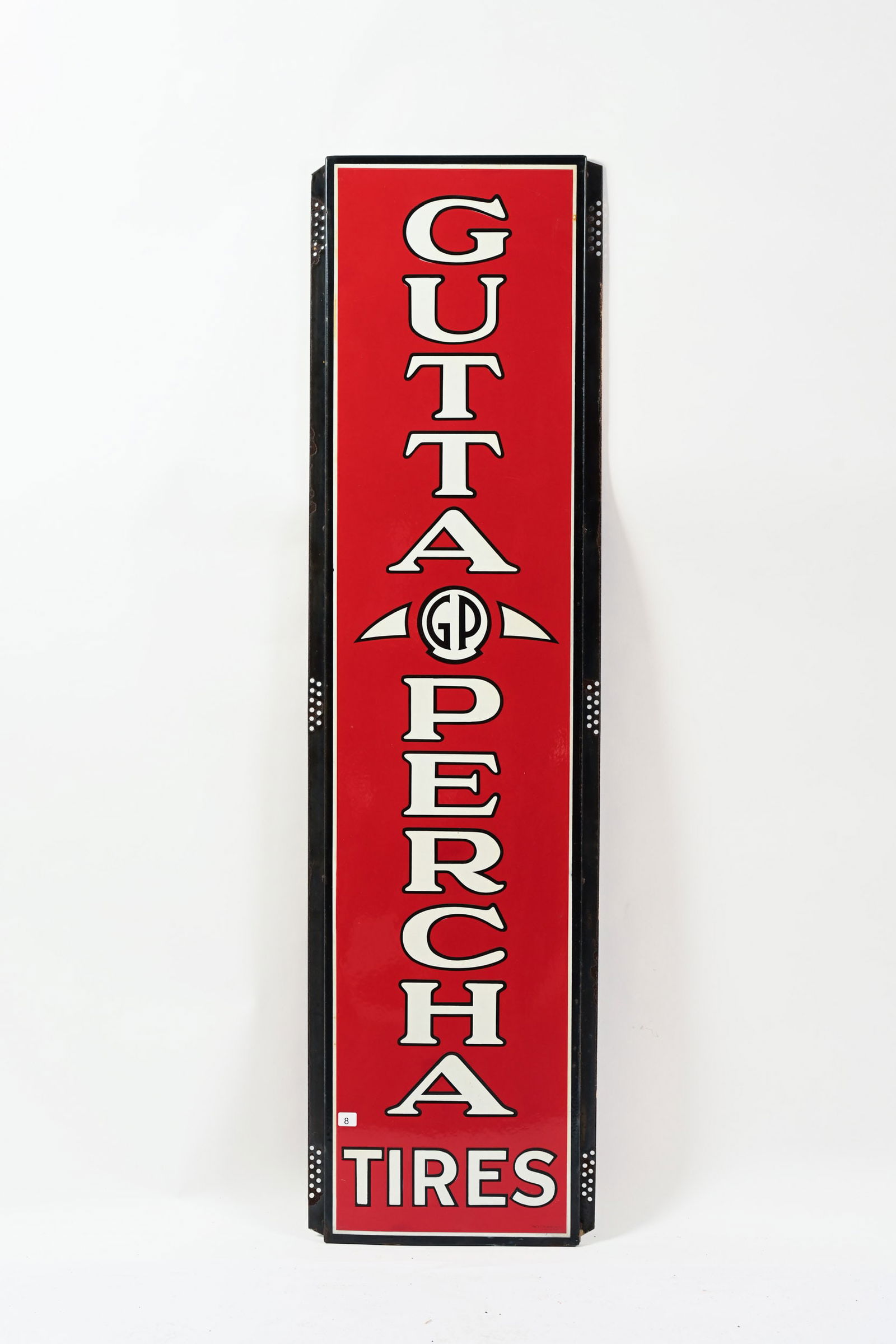 1930'S GUTTA PERCHA TIRES PORCELAIN VERTICAL SIGN: 1930'S GUTTA PERCHA TIRES PORCELAIN VERTICAL SIGN MARKED THE W.F. VILAS CO. LTD COWANSVILLE, PQ SELF FRAMED EDGE EXCELLENT COLOURS AND GLOSS FIELD IN NEAR MINT CONDITON FACTORY FLAW TO THE RIGHT