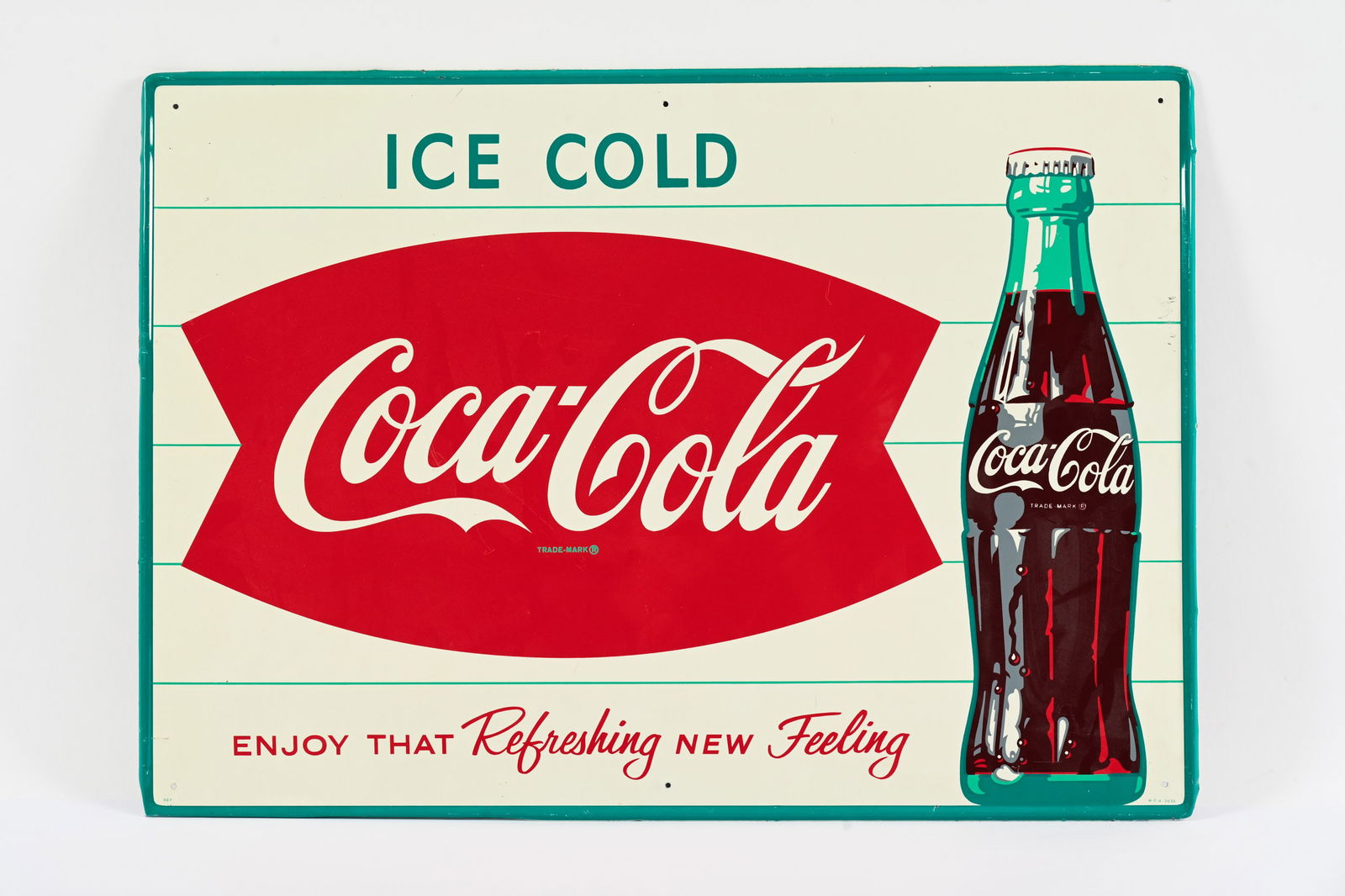 1950'S ICE COLD COCA-COLA FISHTAIL TIN SIGN: 1950'S ICE COLD COCA-COLA "ENJOY THAT REFRESHING NEW FEELING" FISHTAIL TIN SIGN MARKED MCA 2033 EXCELLENT COLOURS AND GLOSS NEW OLD STOCK CONDITION SHOWS SOME MINOR SURFACE WEAR TO RIGHT EDGE