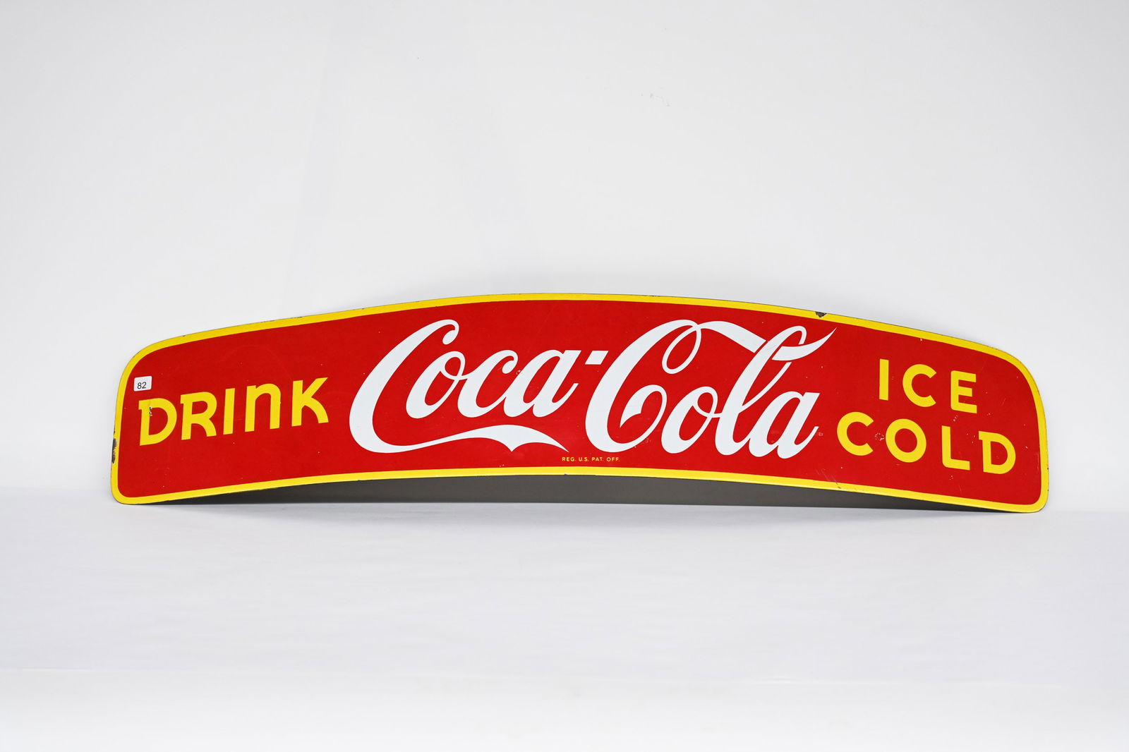 1950'S DRINK COCA-COLA PORC. DELIVERY TRUCK TOPPER: 1950'S DRINK COCA-COLA ICE COLD PORCELAIN DELIVERY TRUCK TOPPER NOT MARKED EXCELLENT COLOURS AND GLOSS FIELD IN VERY GOOD CONDITION WITH MINIMAL PORCELAIN LOSS PORCELAIN LOSS MOST EVIDENT ALONG THE ED