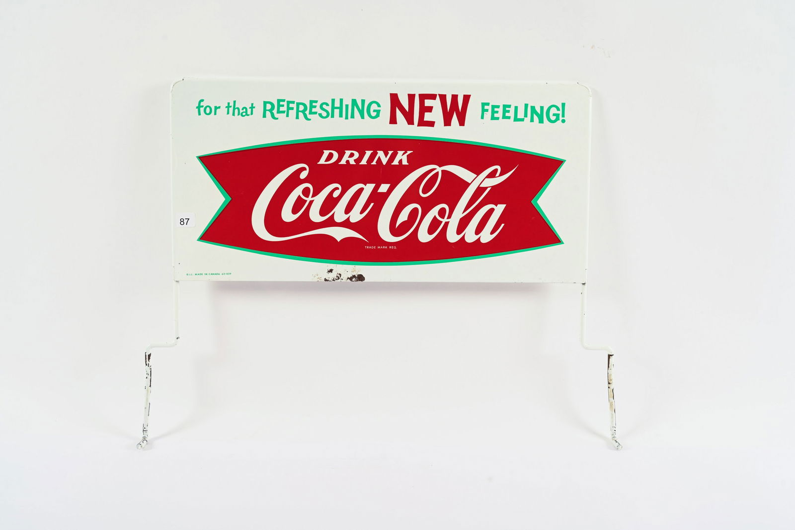 1960'S DRINK COCA-COLA "FISHTAIL" D/S TIN RACK SIGN: 1960'S DRINK COCA-COLA "FISHTAIL" DOUBLE SIDED TIN RACK SIGN MARKED G.I.L. MADE IN CANADA 62-029 GOOD COLOURS AND GLOSS SHOWS ONE AREA OF PAINT LOSS AT BOTTOM EDGE ON FRONT SIDE BACK SIDE SHOWS SOME S