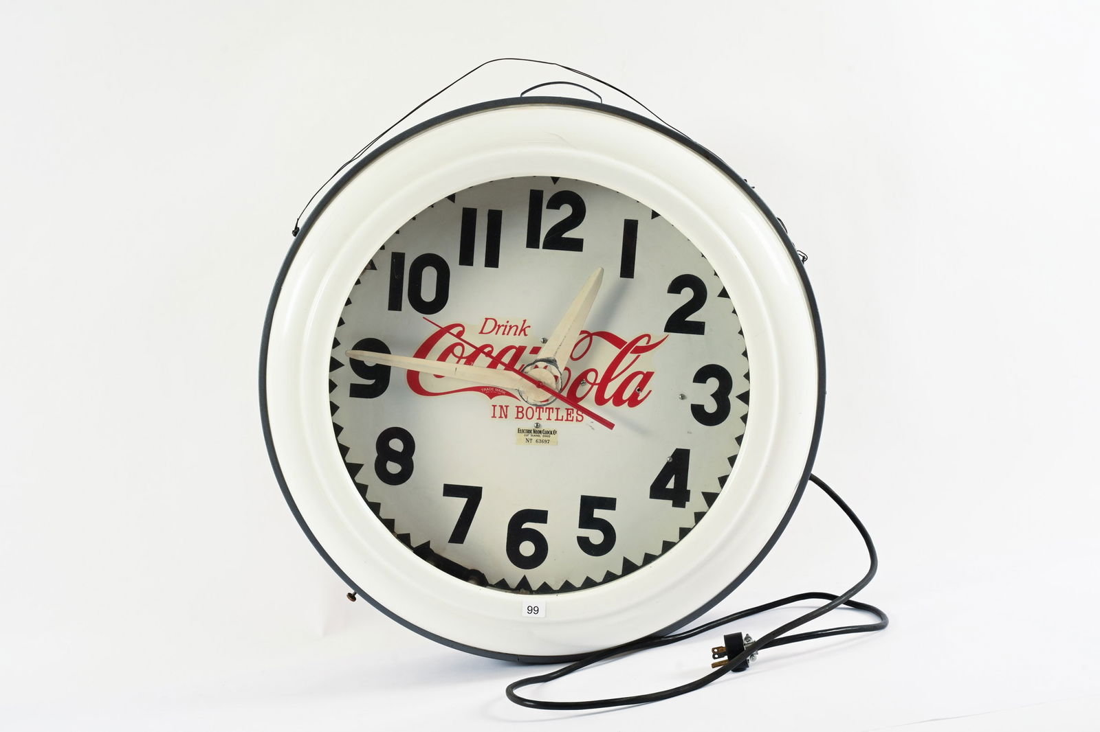 1950'S COCA-COLA CLEVELAND ELECTRIC NEON CLOCK: 1950'S DRINK COCA-COLA IN BOTTLES CLEVELAND ELECTRIC NEON CLOCK MARKED ELECTRIC NEON CLOCK CO. CLEVELAND, OHIO ORIGINAL CONDITON PLASTIC FACE WITH METAL CAN SMALL CRACK TO UPPER PLASTIC EDGE 