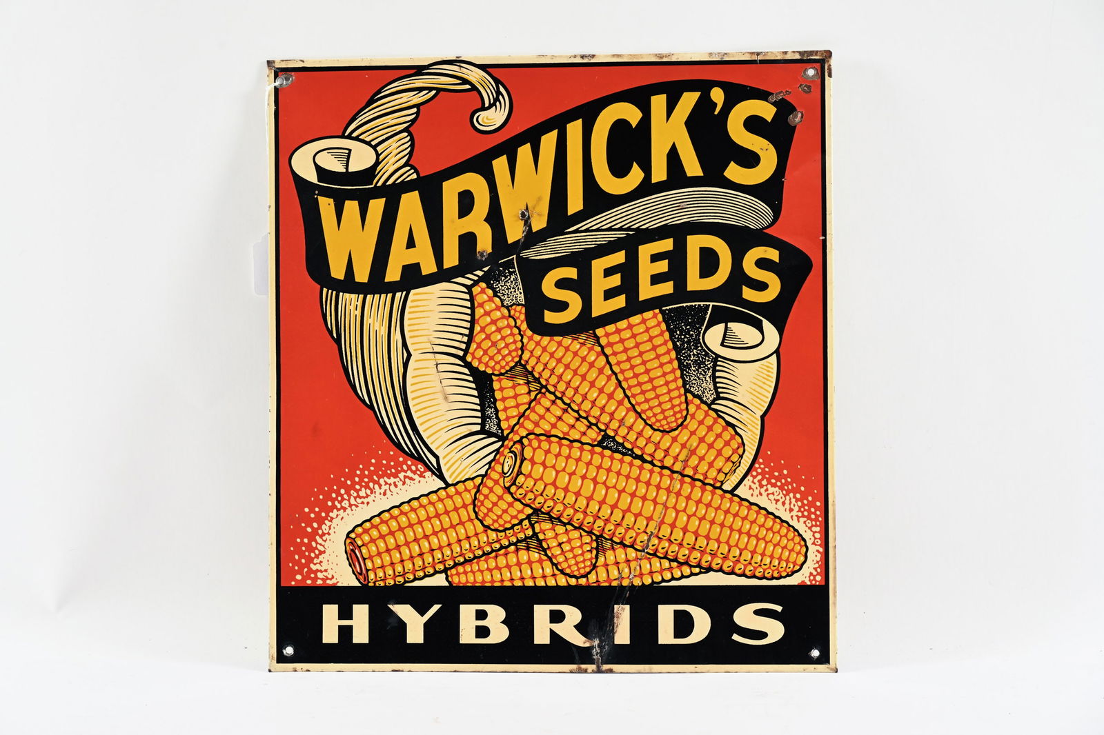 WARWICK'S HYBRIDS SEEDS TIN SIGN: WARWICK'S HYBRIDS SEEDS TIN SIGN NOT MARKED GOOD COLOURS WITH STRONG GRAPHICS FIELD SHOWS SOME WEAR WITH PAINT LOSS CREASE WITH PAINT LOSS AT BOTTOM EDGE EXTENDING INTO FIELD EXTRA HOLES ADDED AT