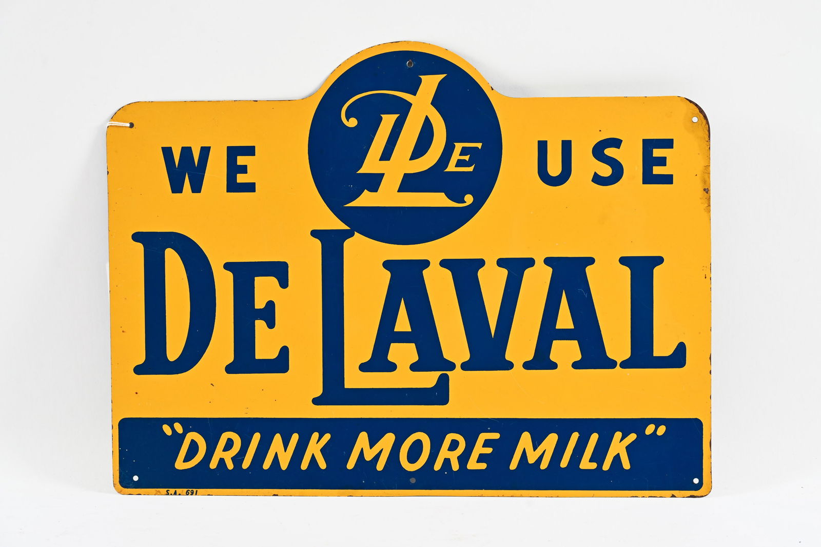 WE USE DE LAVAL "DRINK MORE MILK" TIN SIGN: WE USE DE LAVAL "DRINK MORE MILK" TIN SIGN MARKED S.A. 691 NEW OLD STOCK CONDITION SHOWS SOME EDGE WEAR WITH PAINT LOSS 16"X12" *ALL ITEMS GUARANTEED AUTHENTIC BY SHACKELTON AUCTIONS UNLESS