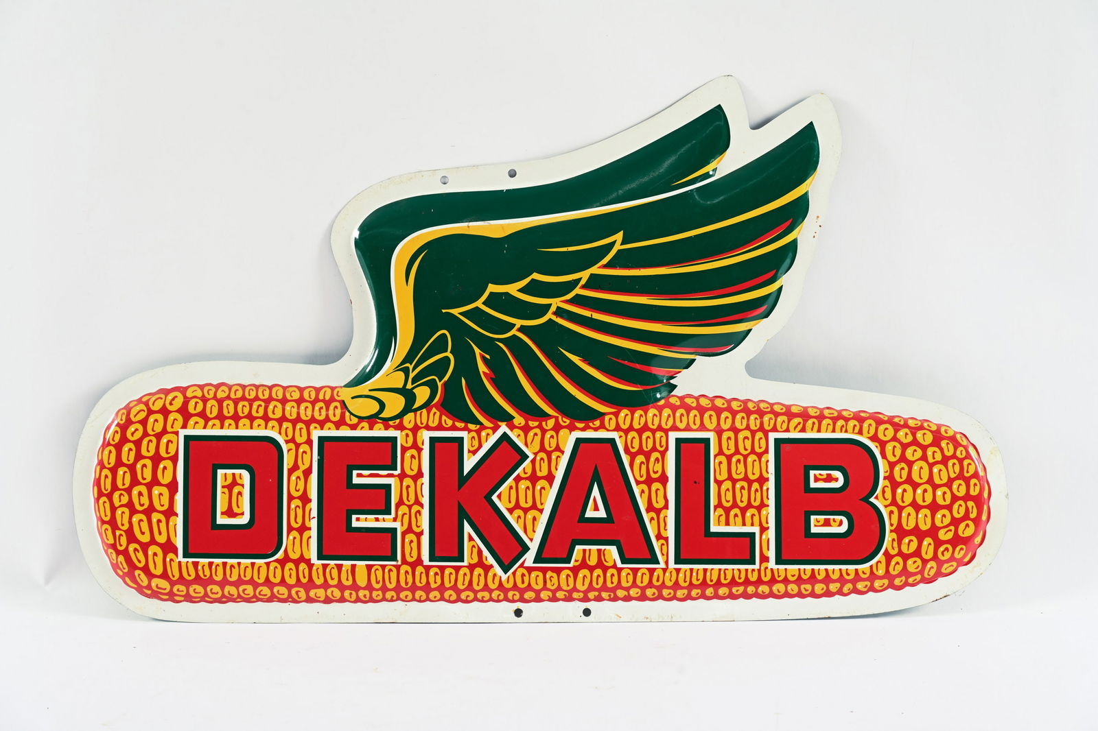 DEKALB CONVEX PAINTED METAL SIGN: DEKALB CONVEX PAINTED METAL SIGN NOT MARKED NEW OLD STOCK CONDITION SOME MINOR SURFACE WEAR 28"X16" *ALL ITEMS GUARANTEED AUTHENTIC BY SHACKELTON AUCTIONS UNLESS OTHERWISE SPECIFIED