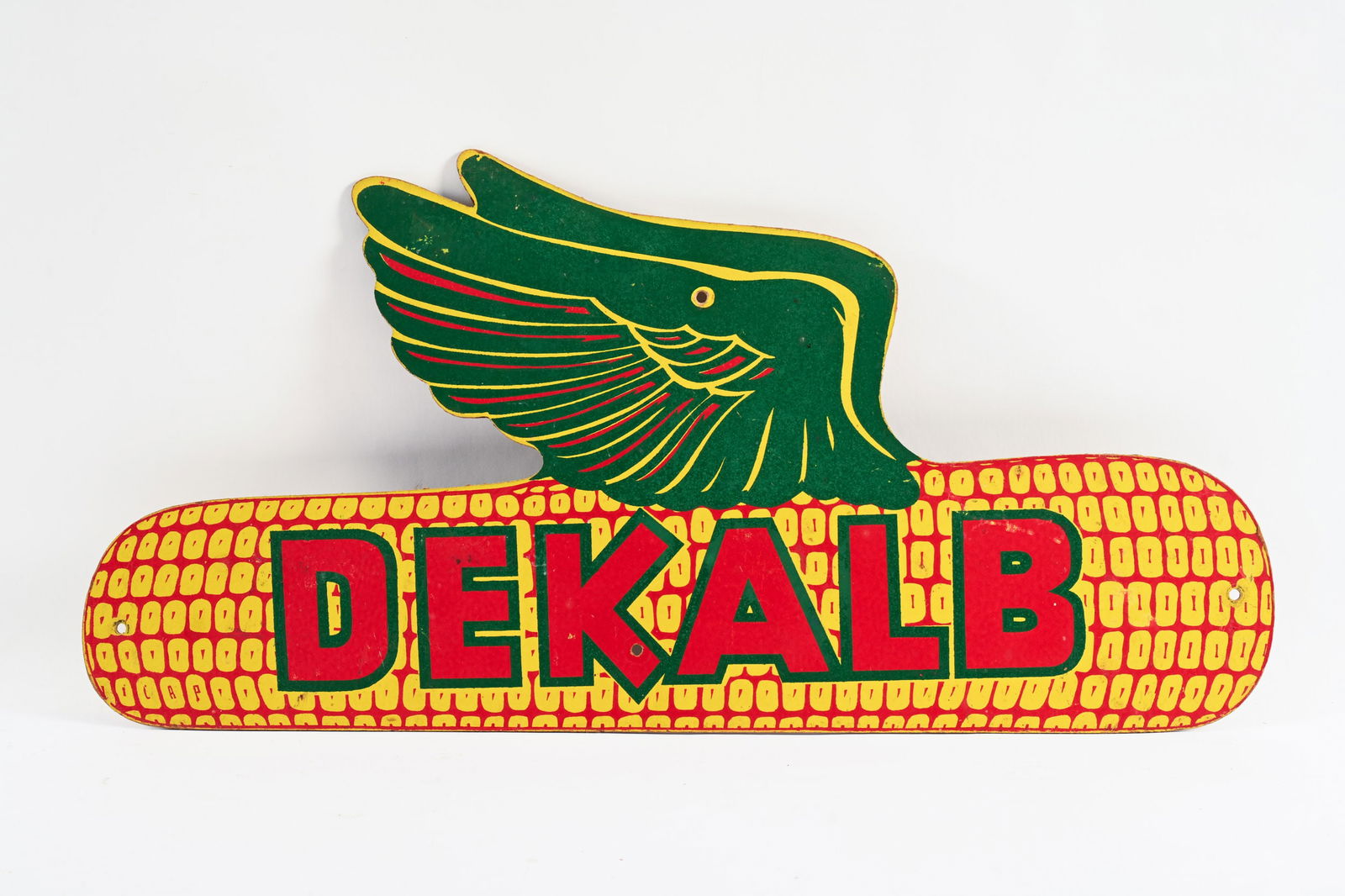 DEKALB MASONITE SIGN: DEKALB MASONITE SIGN NOT MARKED SHOWS SOME WEAR, FADING AND SOFT EDGES 30"X15" *ALL ITEMS GUARANTEED AUTHENTIC BY SHACKELTON AUCTIONS UNLESS OTHERWISE SPECIFIED