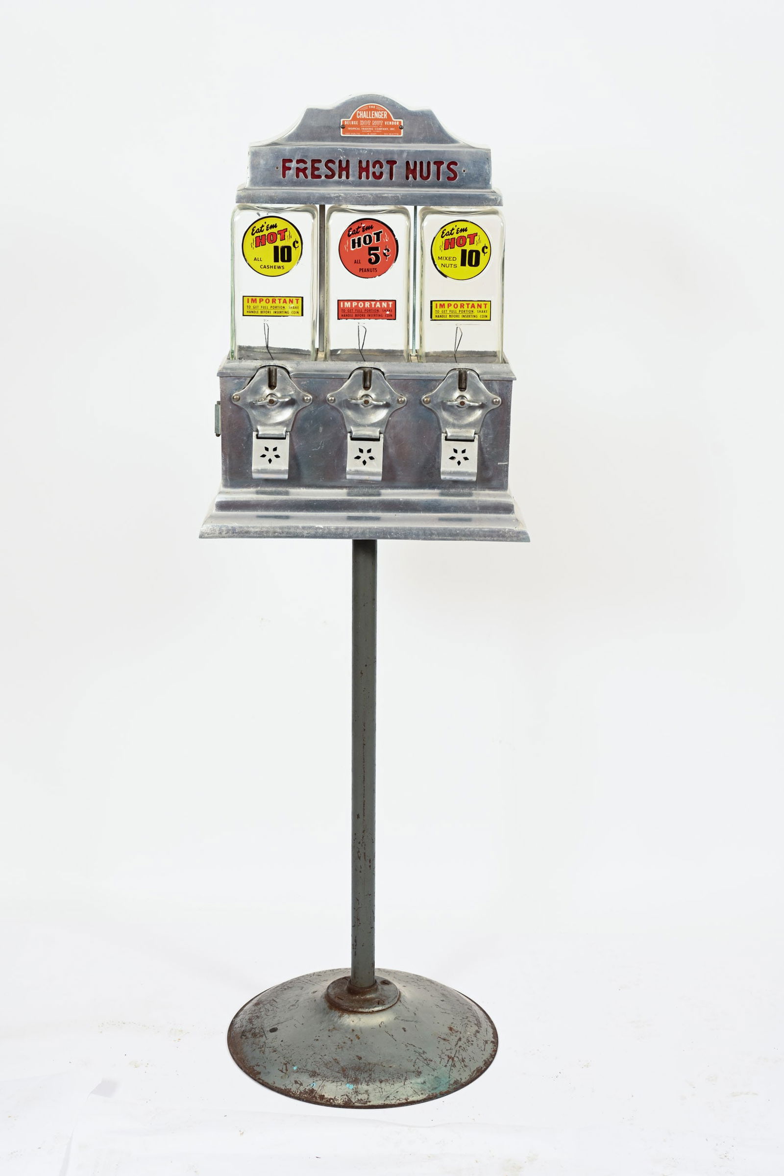 1940S THE CHALLENGER COIN OPERATED VENDING MACHINE: 1940'S THE CHALLENGER DELUXE HOT NUT COIN OPERATED VENDING MACHINE TROPICAL TRADING COMPANY, INC. CHICAGO, ILL IN EXCELLENT ORIGINAL CONDITION REVERSE PAINTED GLASS CYLINDERS WITH PEDESTAL STAND AND K