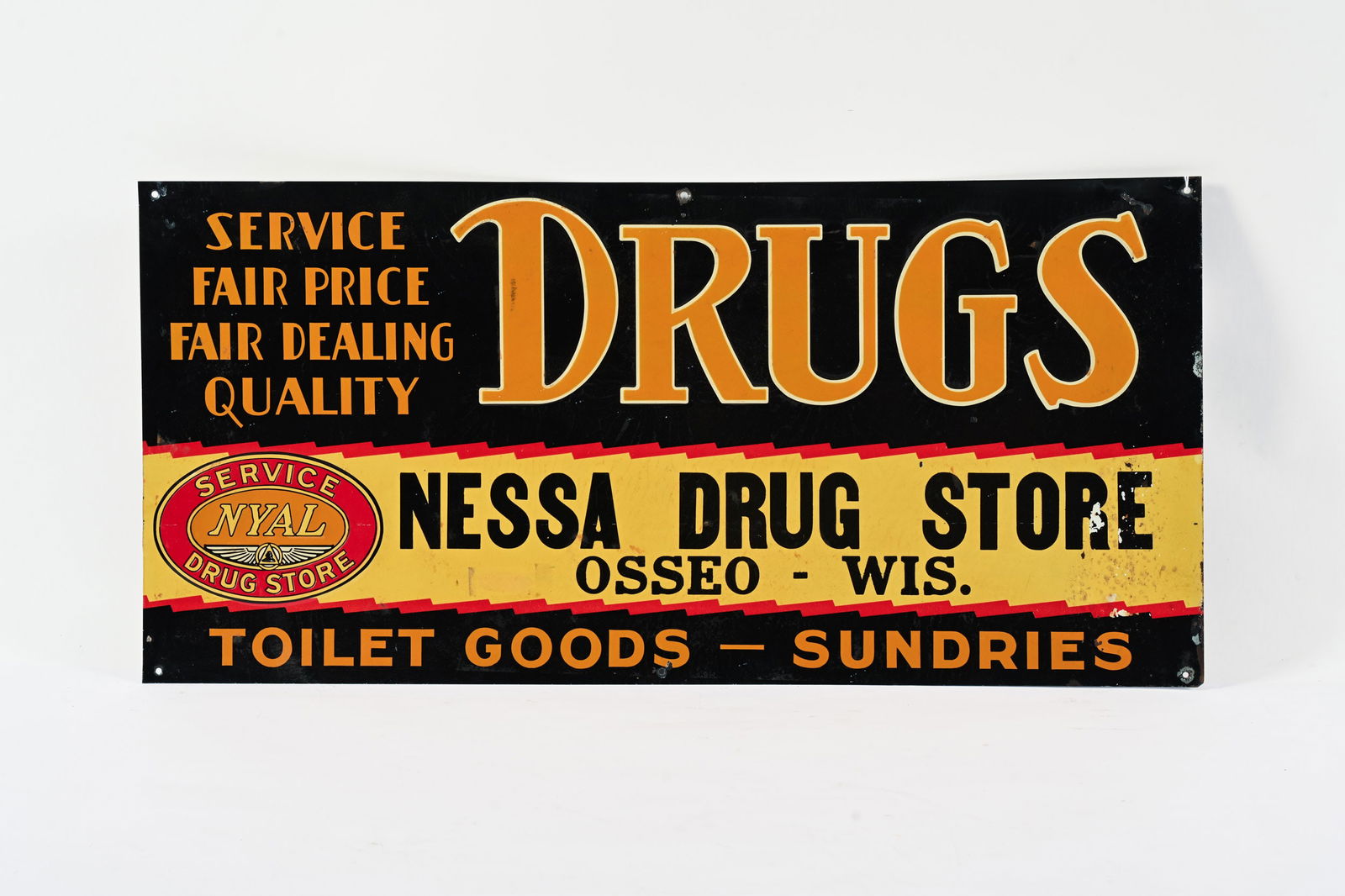 NYAL "DRUGS" NESSA DRUG STORE EMBOSSED TIN SIGN: NYAL "DRUGS" NESSA DRUG STORE EMBOSSED TIN SIGN NYAL SERVICE DRUG STORE NESSA DRUG STORE OSSEO WISCONSIN OVERALL GOOD CONDITION AND STRONG COLOURS SOME WEAR AND STAINING IN FIELD PAINT LOSS MOST EVIDE