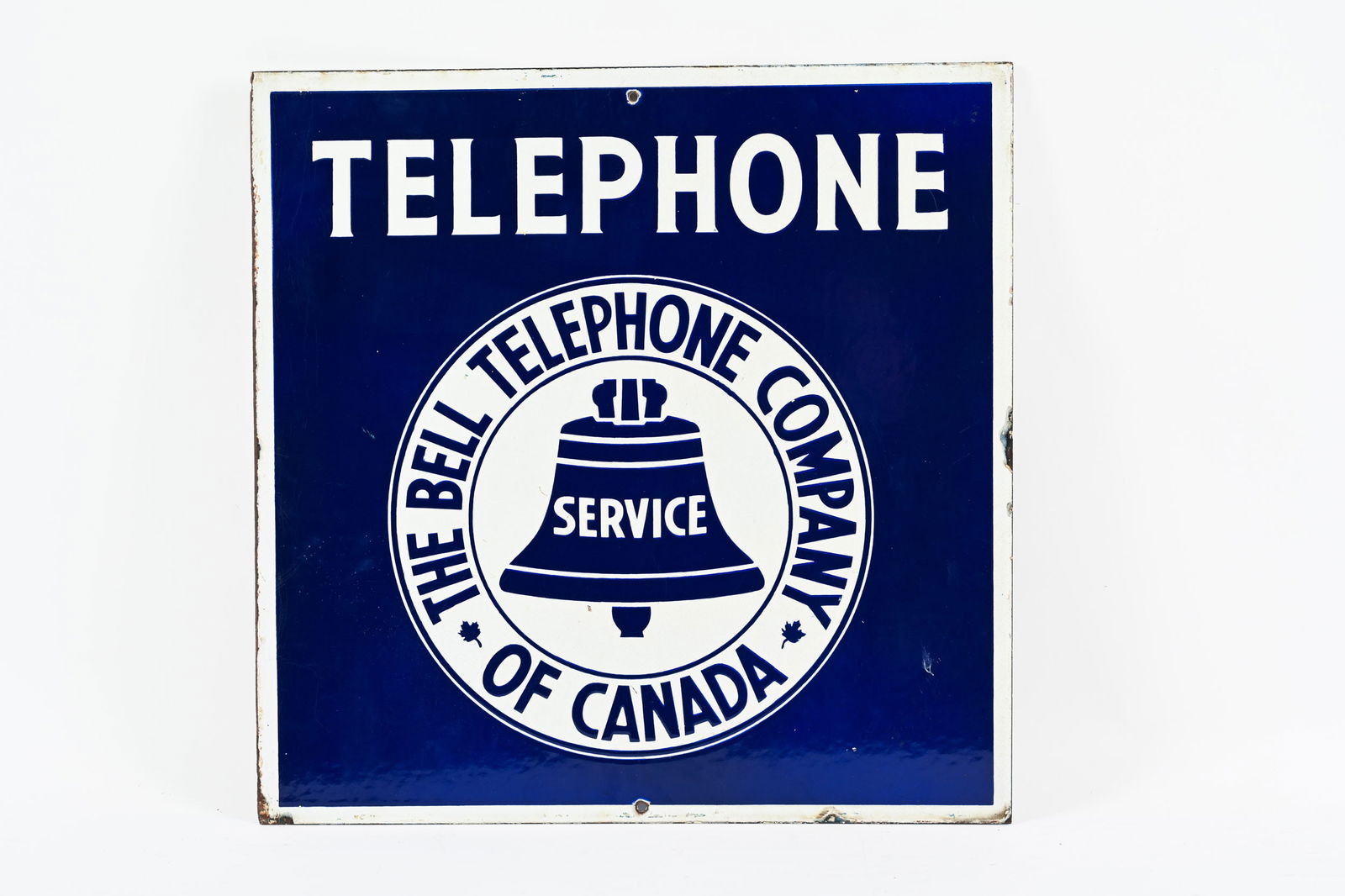 BELL TELEPHONE COMPANY D/S PORCELAIN FLANGE SIGN: BELL TELEPHONE COMPANY DOUBLE SIDED PORCELAIN FLANGE SIGN NOT MARKED STRONG COLOURS AND GLOSS FLANGE HAS BEEN REMOVED MOUTING HOLES ADDED TO TOP AND BOTTOM EDGE BOTH FIELDS ARE CLEAN WITH MINOR