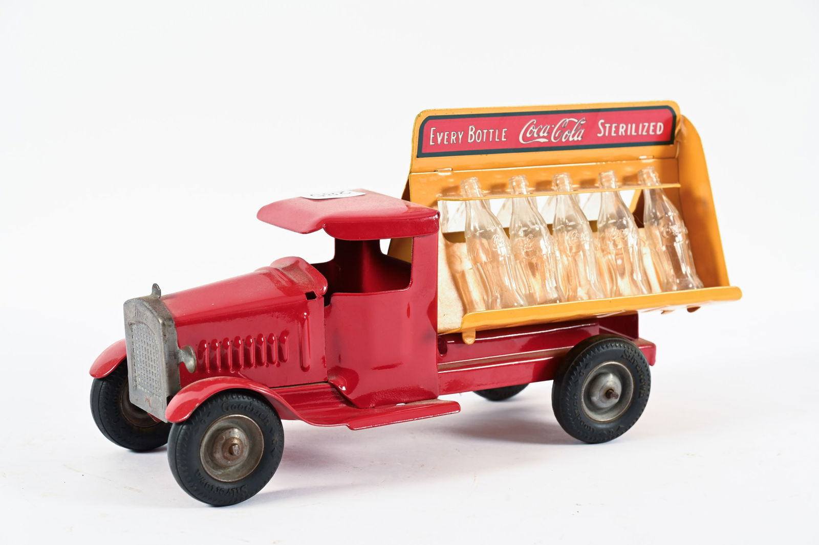 1930'S METALCRAFT COCA-COLA PRESSED STEEL TRUCK: 1930'S METALCRAFT COCA-COLA PRESSED STEEL DELIVERY TRUCK MAREKD METALCRAFT CORP. ST. LOUIS, MADE IN U.S.A. ORIGINAL PAINT VERY GOOD CONDITION WITH 10 MINITURE GLASS COKE BOTTLES 11" ALL ITEMS