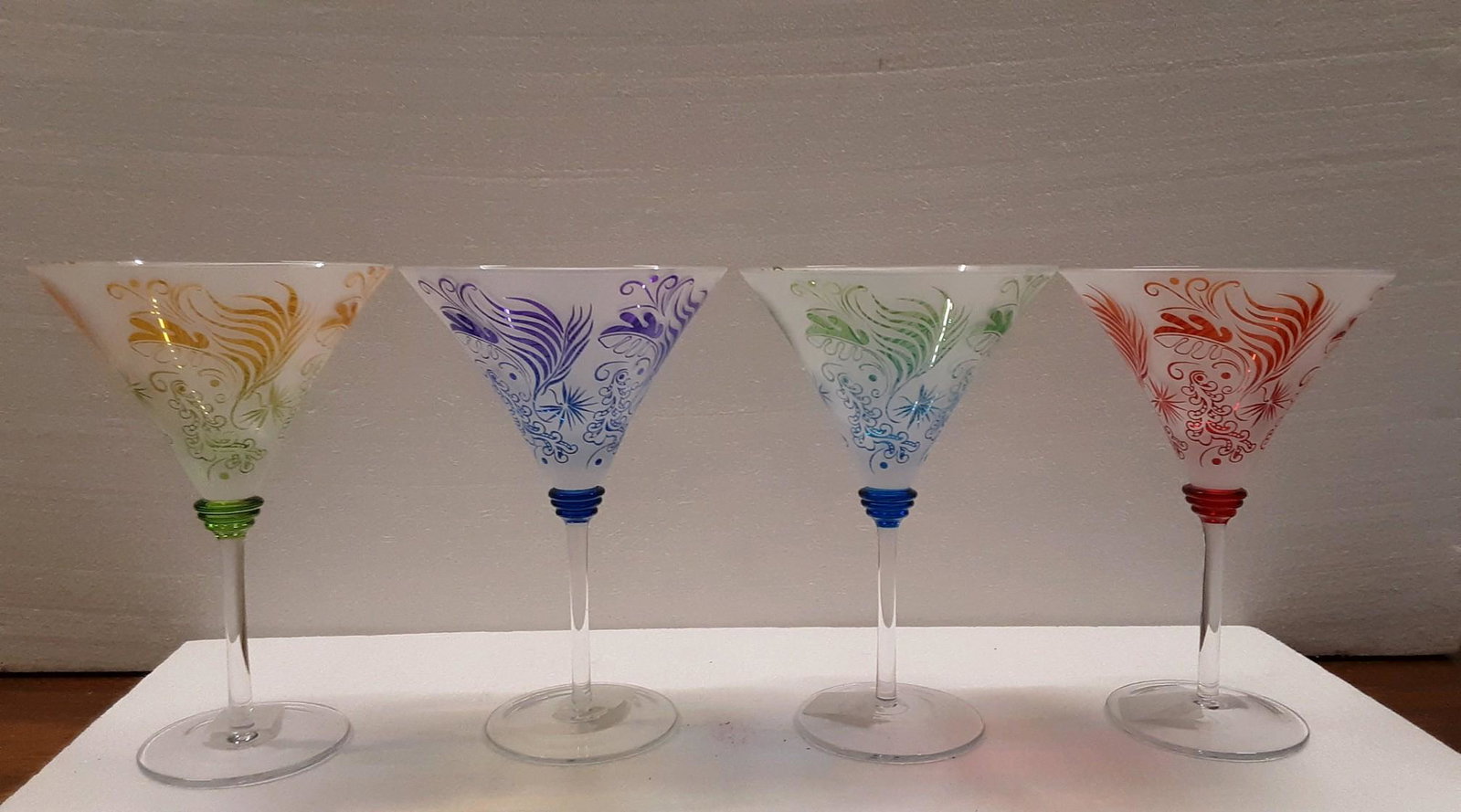 blown, flash glass, engraved martini glasses: Blown glass set of 4 martini glasses. 8 tall x 5.5 wide.These martini glasses are NOT painted, but etched flash glass. High detailed quality.