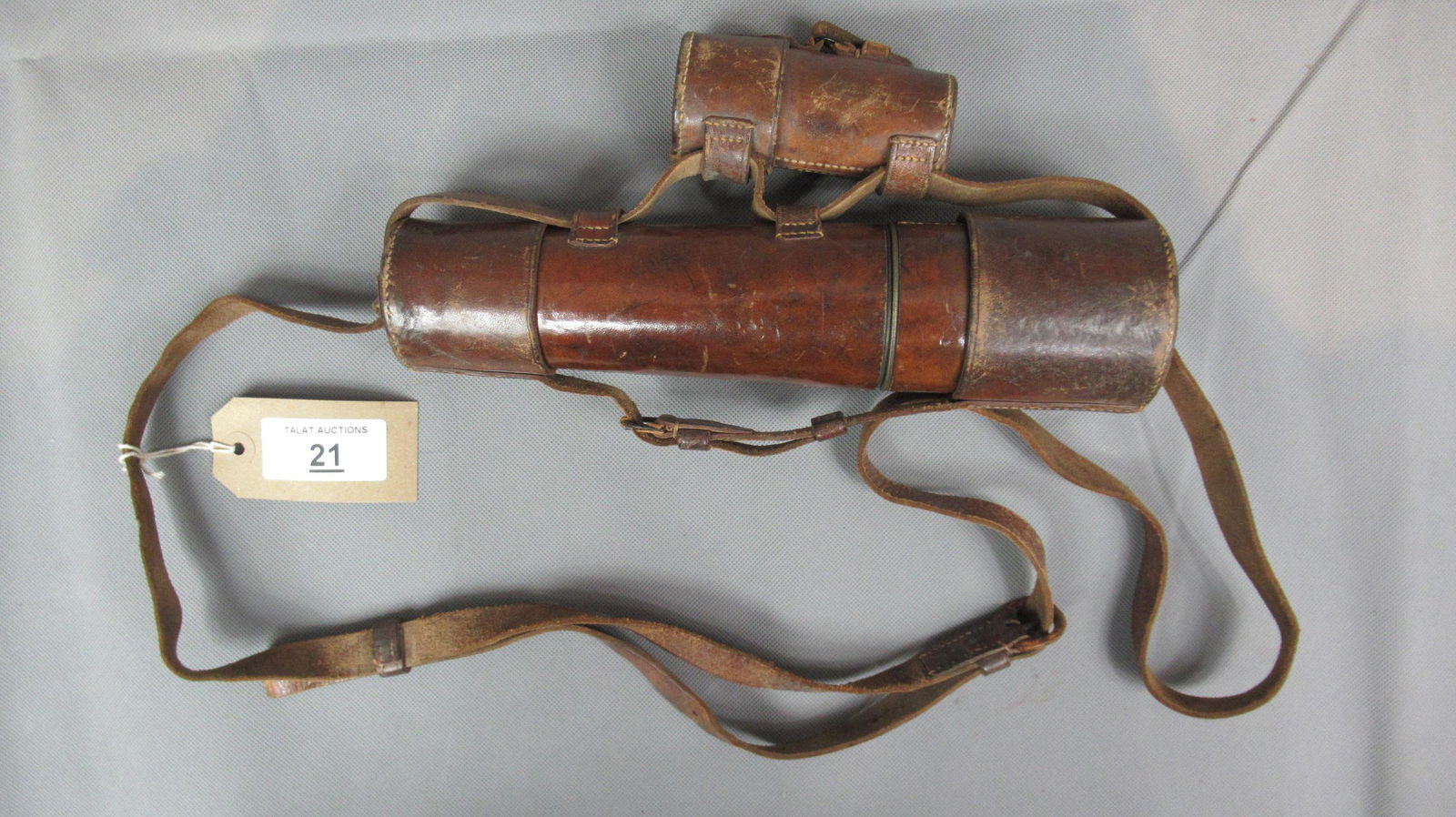 WW1 'Dollond London' Officer's Telescope: Brass body with brown leather case. Maker's stamp, including "9117". Interchangeable "High" and "Low" eyepieces." Length fully extended 89cm.