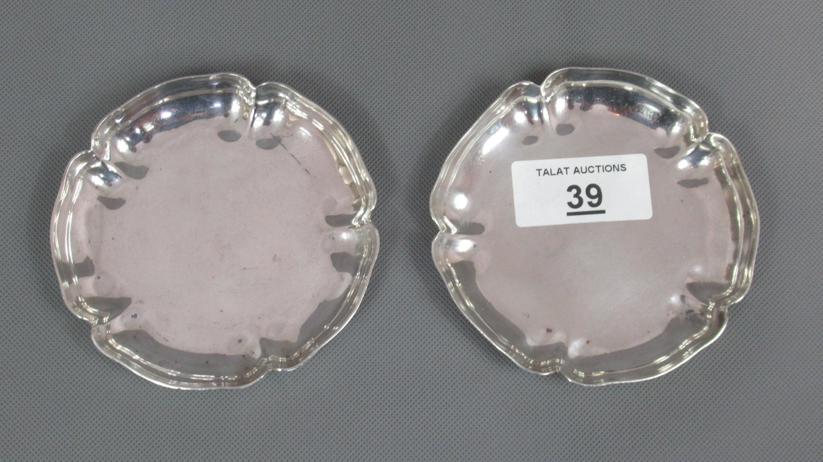 Asprey & Co Silver Pin Trays: Of 'Tudor Rose' shape measuring 11.5cm. Clear hallmarks, London 1970. Weight 312g.