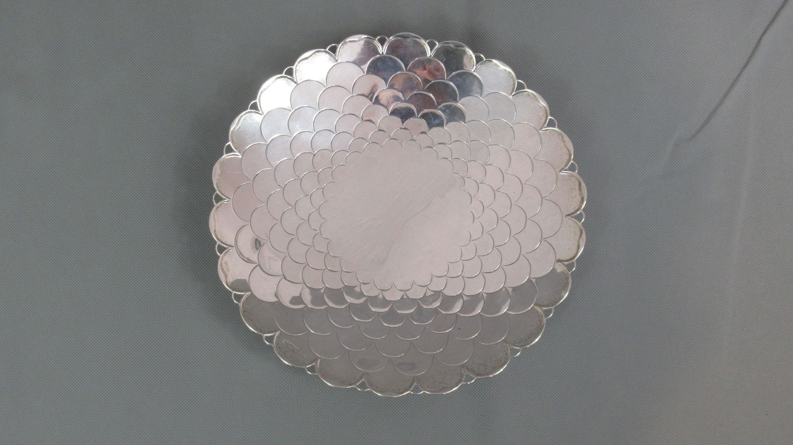 Mappin & Webb Silver Tazza: Fish Scale' decoration measuring 23cm diameter. Base slightly uneven. Good hallmark, Sheffield 1947. Weight 419g.