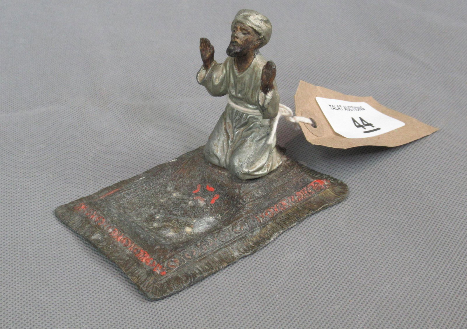 Bergman' Style Painted Arab Figure: A spelter painted figure of an Arab at prayer on a rug in the 'Bergman' style. 10 x 7 x 8cm.