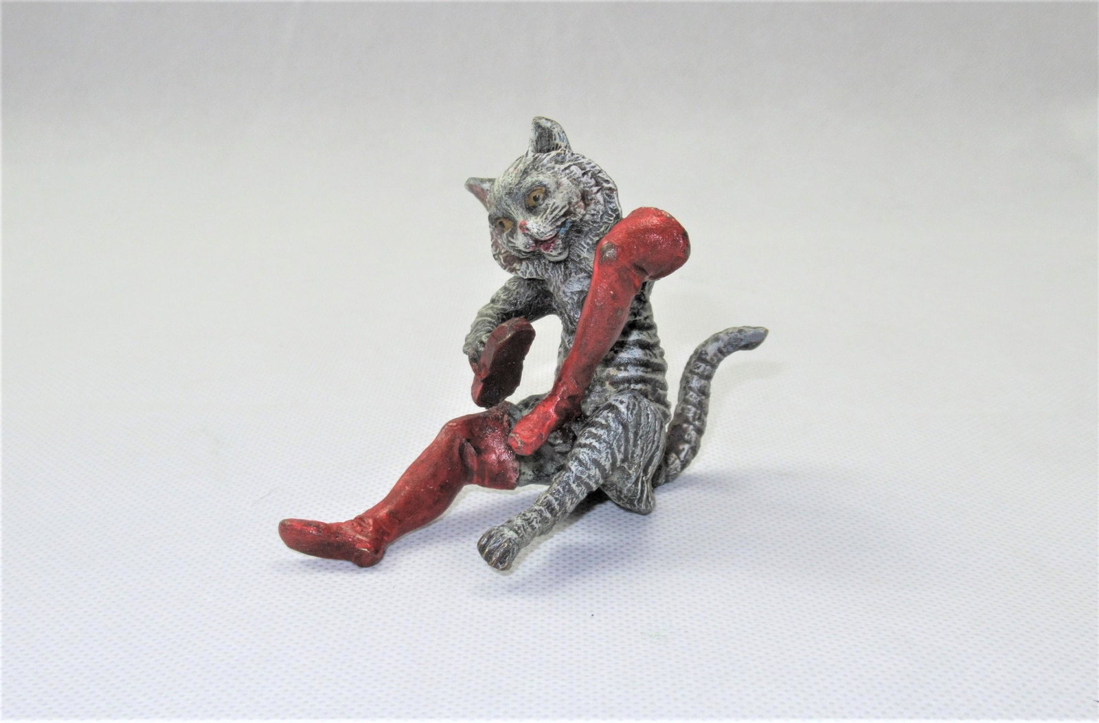 Painted Bronze of a Cat: Painted bronze figure of 'Puss In Boots'. Approximate height 8cm.