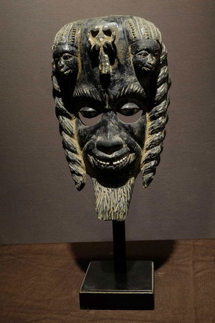 Dark Ibo mask with three miniatures on top