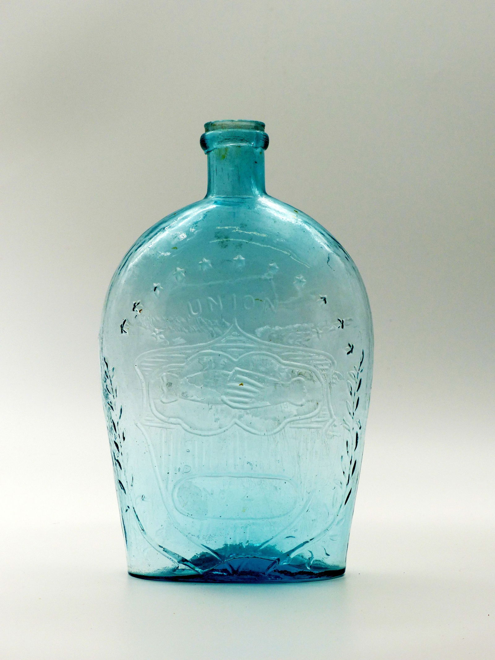 Union No. 2. Shaking Hands Flask: Union No. 2. Shaking hands flask -Flying Eagle with Ribbon on opposite side. ; Aqua. ; Condition: Mint ; 8.75"H